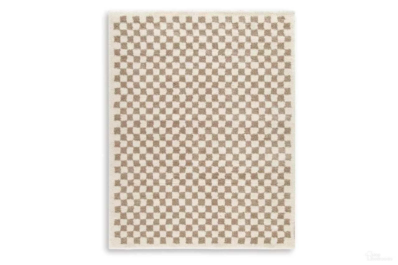 The appearance of Karamen Large Rug In Taupe/Ivory designed by Signature Design by Ashley in the transitional interior design. This taupe/ivory piece of furniture  was selected by 1StopBedrooms from Karamen Collection to add a touch of cosiness and style into your home. Sku: R407341. Material: Fabric.