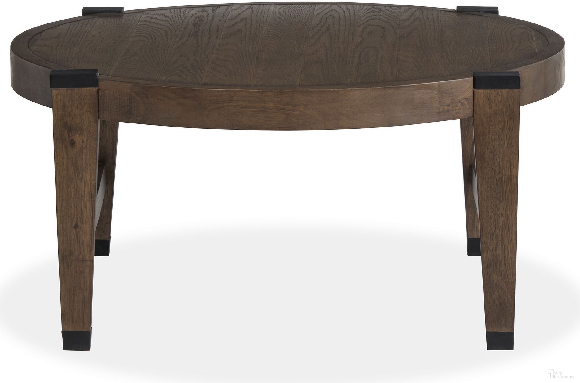 The appearance of Kaysen Round Cocktail Table In Wallaby And Matte Black designed by Magnussen in the transitional interior design. This wallaby and matte black piece of furniture  was selected by 1StopBedrooms from Kaysen Collection to add a touch of cosiness and style into your home. Sku: T5817-45. Material: Oak Veneer.