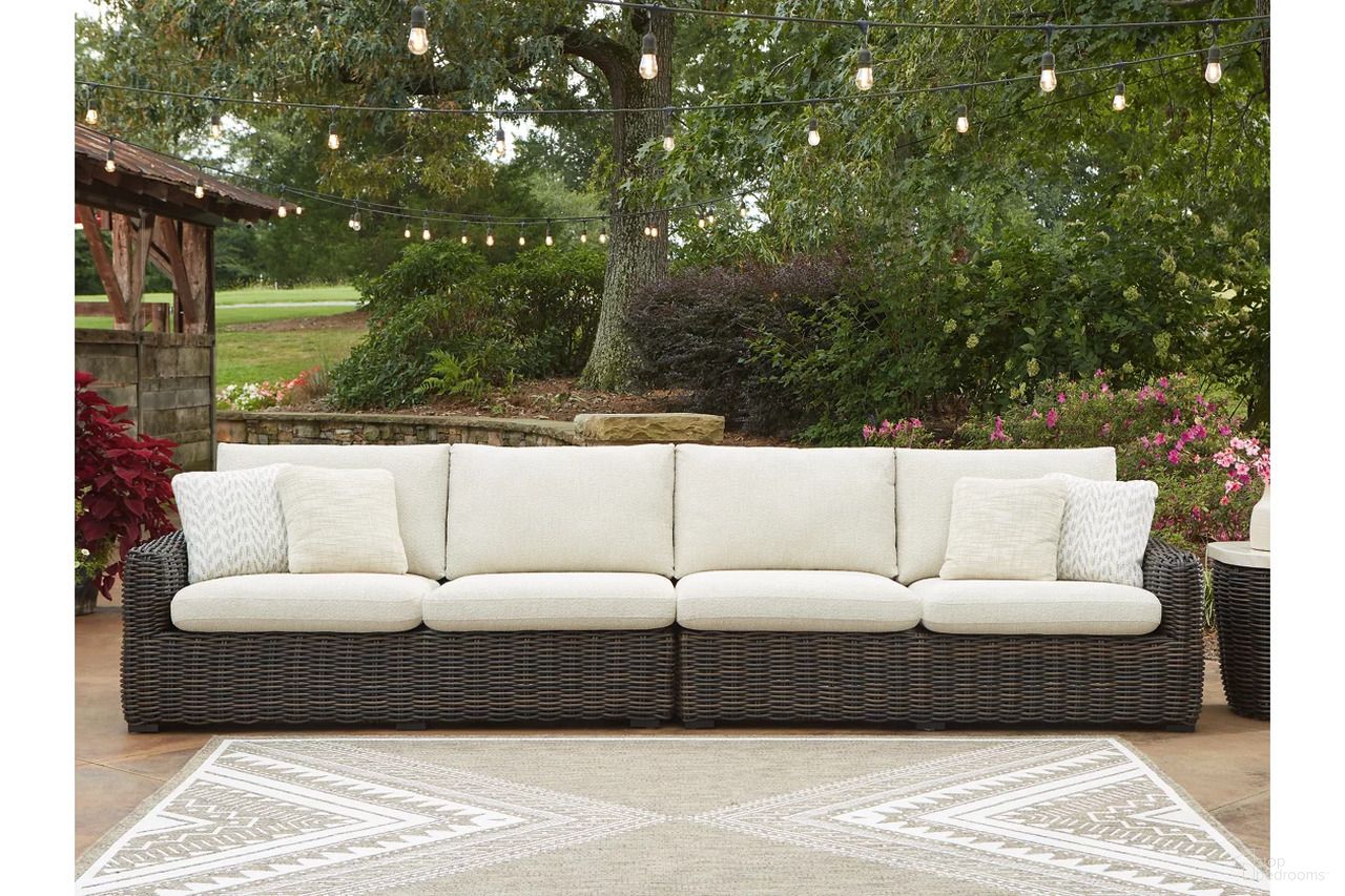 The appearance of Kimora Outdoor Right and Left-arm Facing Loveseat with Cushion Set of 2 In Beige and Dark Brown designed by Signature Design by Ashley in the transitional interior design. This beige and dark brown piece of furniture was selected by 1StopBedrooms from Kimora Collection to add a touch of cosiness and style into your home. Sku: P711-854. Material: Fabric.