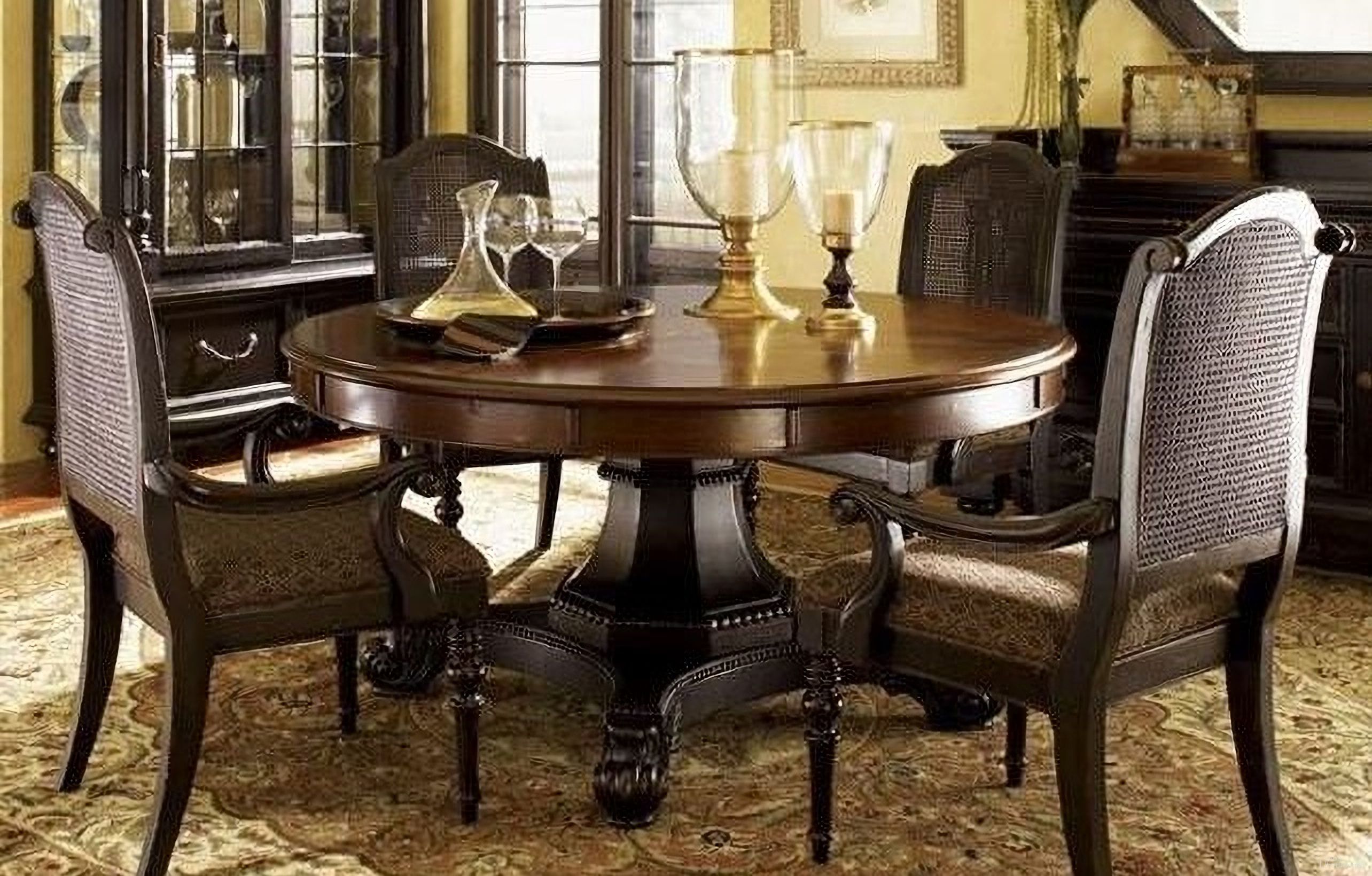 The appearance of Kingstown Cassis Bonaire Round Extendable Dining Room Set designed by Tommy Bahama in the traditional interior design. This cassis piece of furniture  was selected by 1StopBedrooms from Kingstown Collection to add a touch of cosiness and style into your home. Sku: 621-870C;619-885-01. Table Base Style: Pedestal. Table Top Shape: Round. Material: Leather. Size: 60".