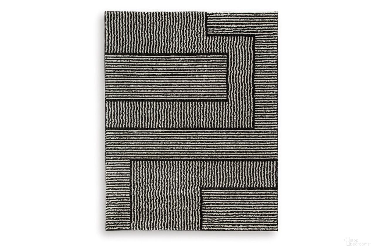 The appearance of Kurtmen 7'10" x 9'10" Area Rug In Black and Ivory designed by Signature Design by Ashley in the modern / contemporary interior design. This black/ivory piece of furniture  was selected by 1StopBedrooms from Kurtmen Collection to add a touch of cosiness and style into your home. Sku: R407591.