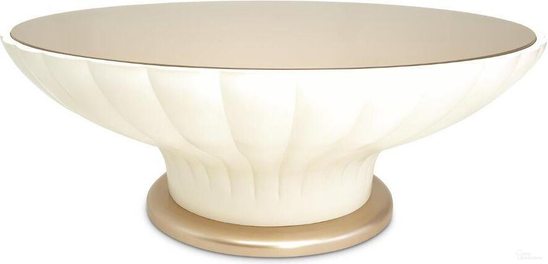 The appearance of La Rachelle Round Scalloped Cocktail Table In Champagne designed by Michael Amini in the modern / contemporary interior design. This champagne piece of furniture was selected by 1StopBedrooms from La Rachelle Collection to add a touch of cosiness and style into your home. Sku: 9034204-136. Material: Wood.
