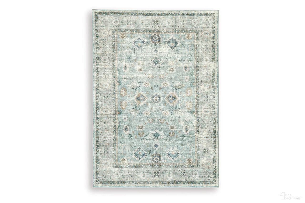 The appearance of Ladstoney 5' x 7' Area Rug In Teal/Beige/Ochre designed by Signature Design by Ashley in the traditional interior design. This teal/beige/ochre piece of furniture was selected by 1StopBedrooms from Ladstoney Collection to add a touch of cosiness and style into your home. Sku: R407502. Material: Polyester.
