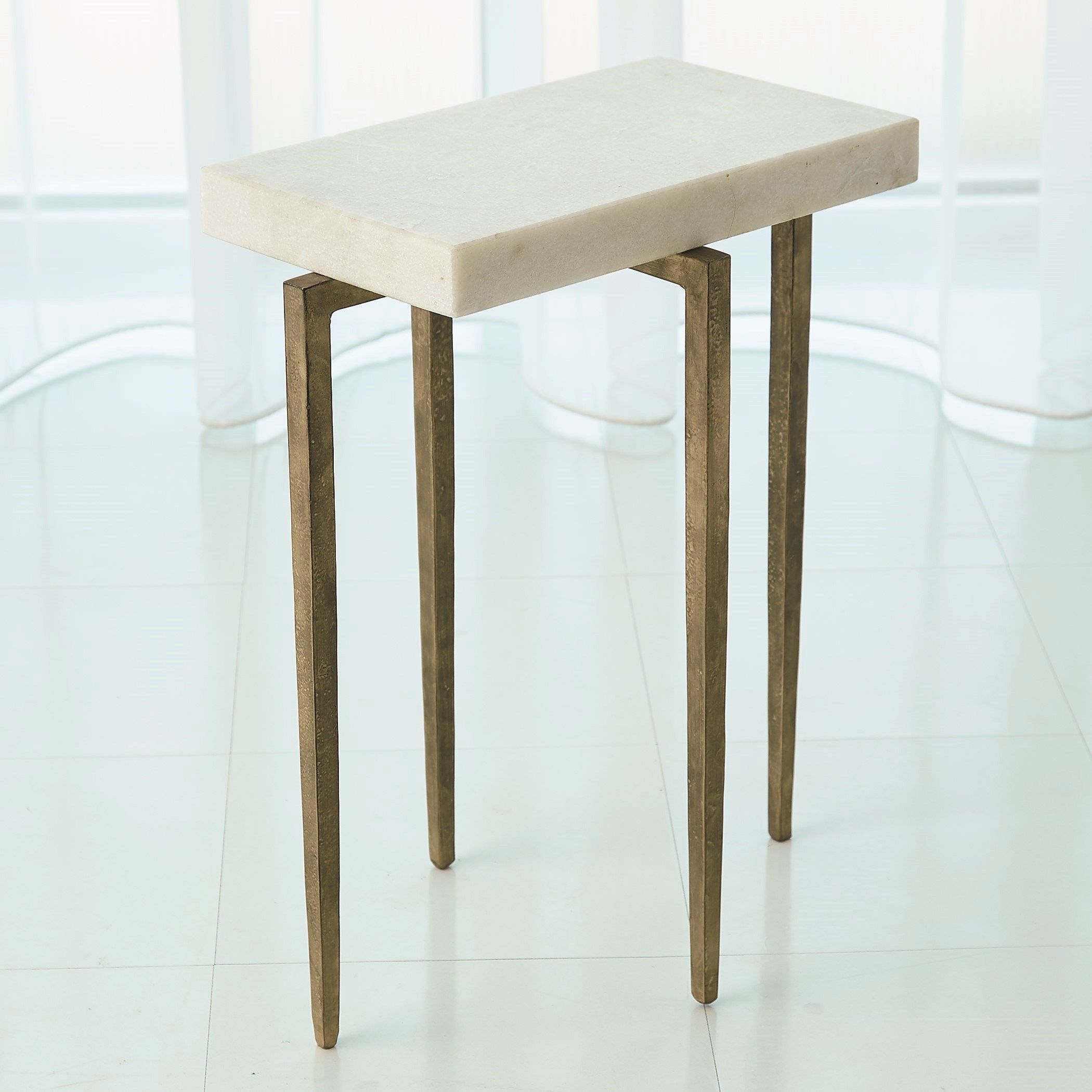 The appearance of Laforge Accent Table In Antique Gold With White Honed Marble Top designed by Global Views in the modern / contemporary interior design. This white piece of furniture  was selected by 1StopBedrooms from Laforge Collection to add a touch of cosiness and style into your home. Sku: 790859. Material: Iron.