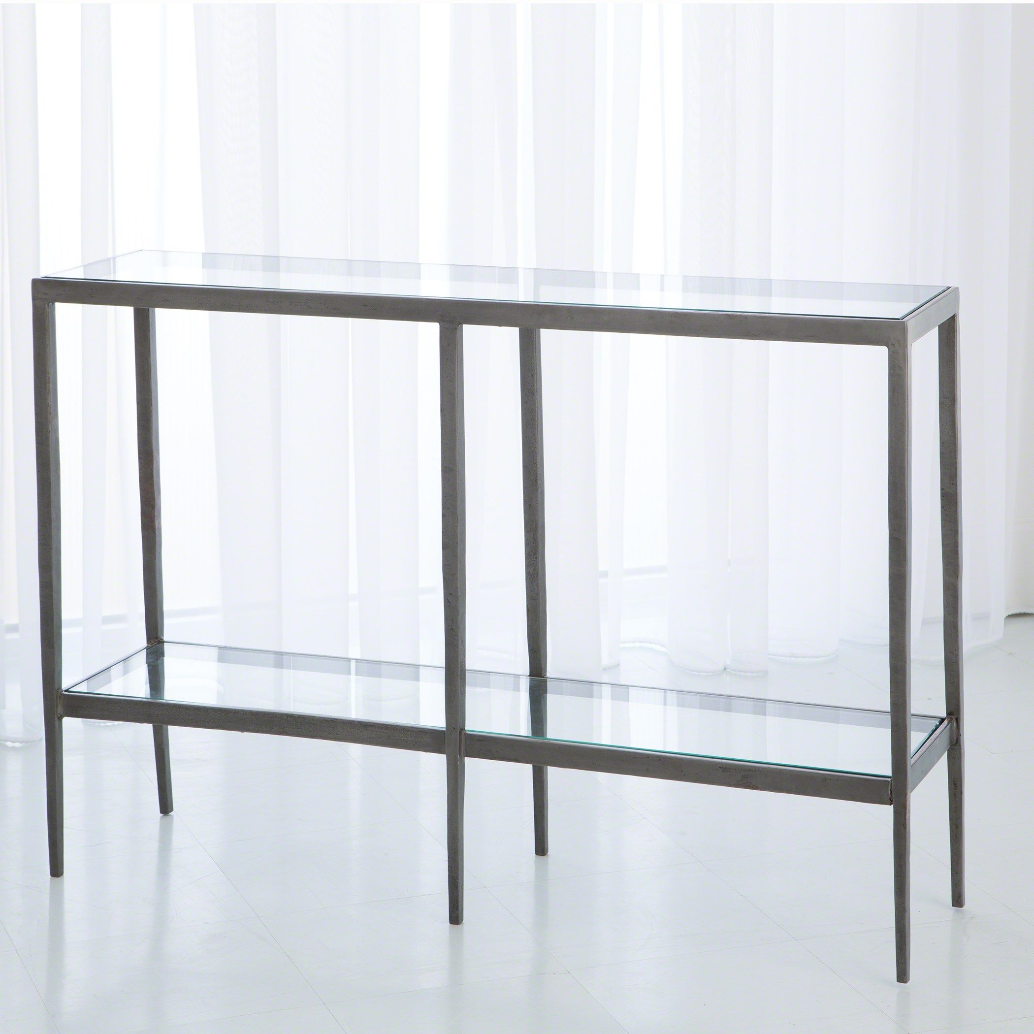 The appearance of Laforge Iron Console In Braised Brass designed by Global Views in the modern / contemporary interior design. This gray piece of furniture  was selected by 1StopBedrooms from Laforge Collection to add a touch of cosiness and style into your home. Sku: 790577. Material: Iron.