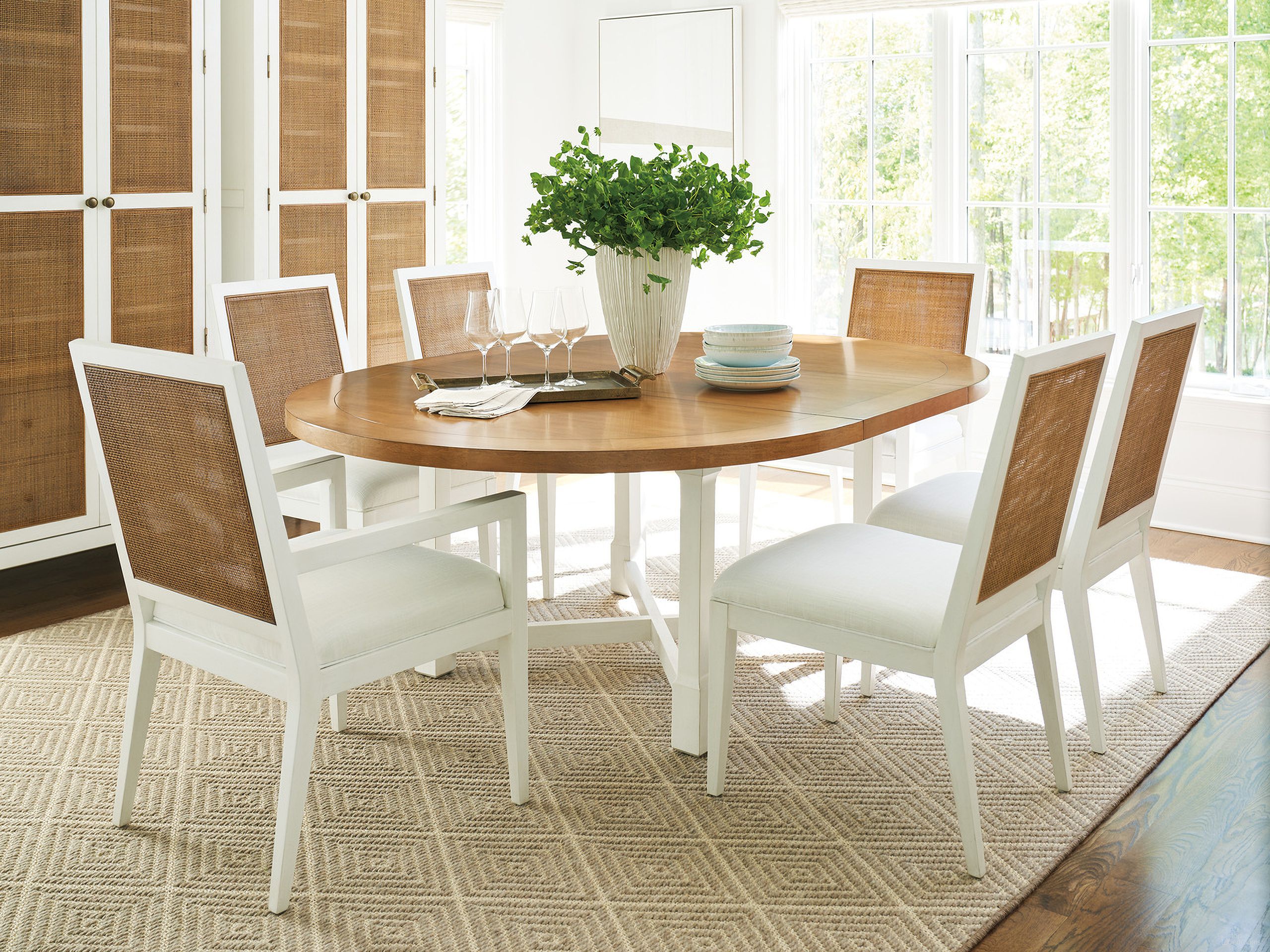 The appearance of Laguna Capistrano Dining Room Set In Tides designed by Barclay Butera in the transitional interior design. This tides piece of furniture was selected by 1StopBedrooms from Laguna Collection to add a touch of cosiness and style into your home. Sku: 935-875C;935-880-01. Table Top Shape: Oval. Material: Wood. Size: 58" x 58".