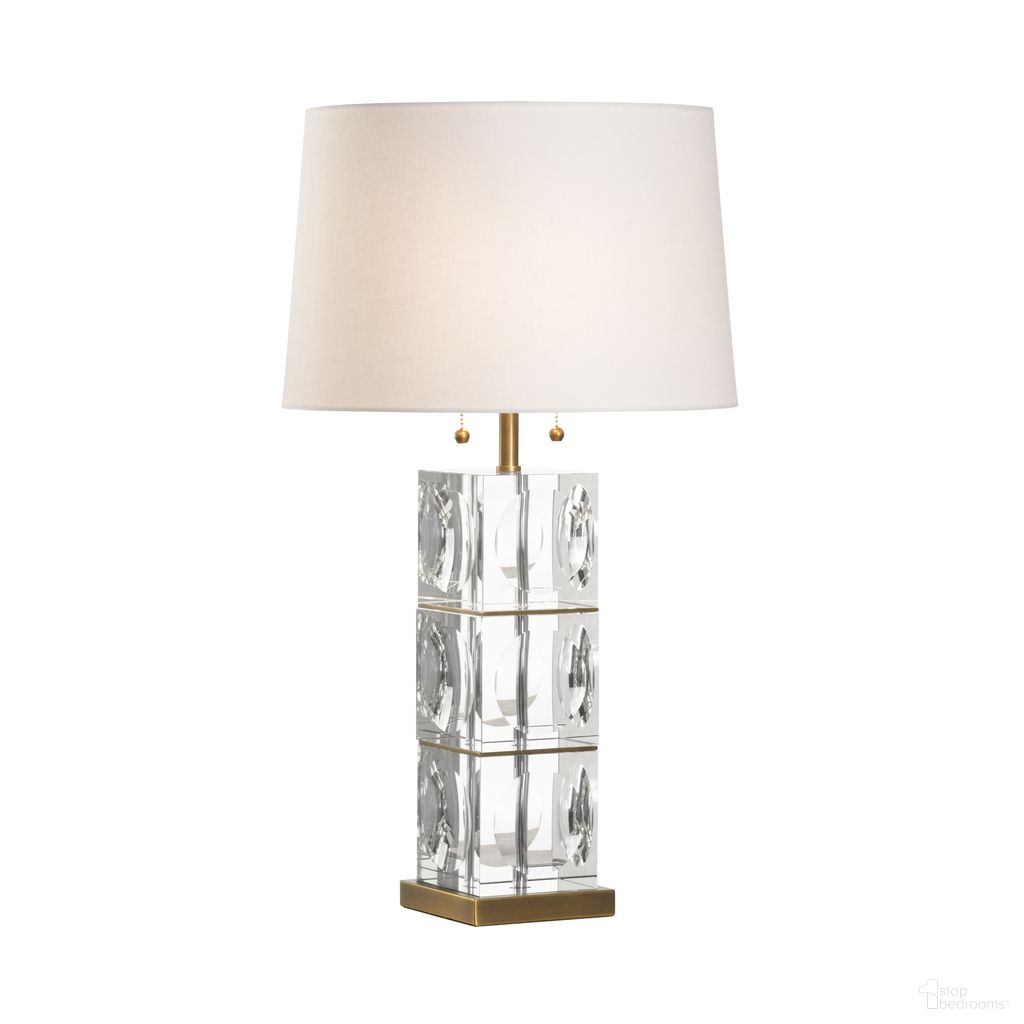 The appearance of Lasater Lamp In Clear designed by Wildwood in the modern / contemporary interior design. This clear piece of furniture  was selected by 1StopBedrooms from Denise McGaha Collection to add a touch of cosiness and style into your home. Sku: 15332. Material: Glass.