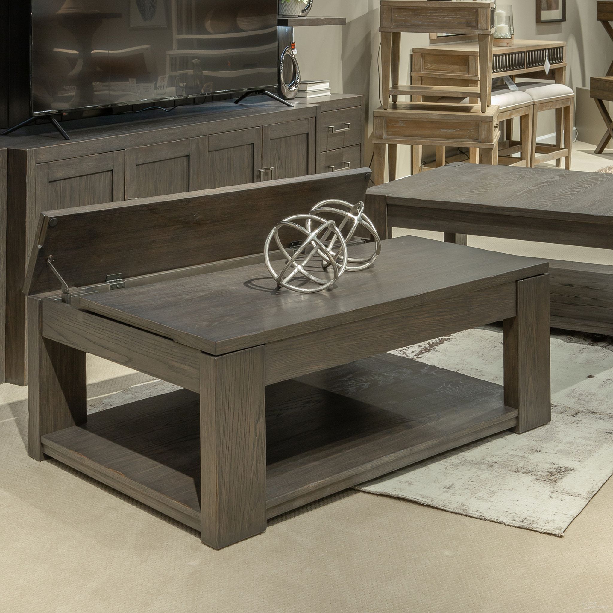 The appearance of Lennox Hill Lift Top Cocktail Table In Bark designed by Liberty in the transitional interior design. This bark piece of furniture  was selected by 1StopBedrooms from Lennox Hill Collection to add a touch of cosiness and style into your home. Sku: 201-OT1010. Material: Solid Rubberwood.
