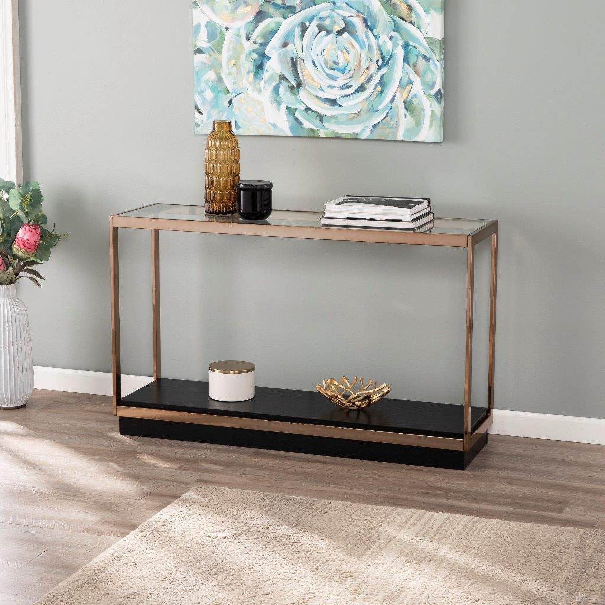 The appearance of Lexina Glass Top Console Table designed by SEI Furniture in the transitional interior design. This champagne piece of furniture was selected by 1StopBedrooms from Lexina Collection to add a touch of cosiness and style into your home. Sku: CK1005403. Material: Wood.