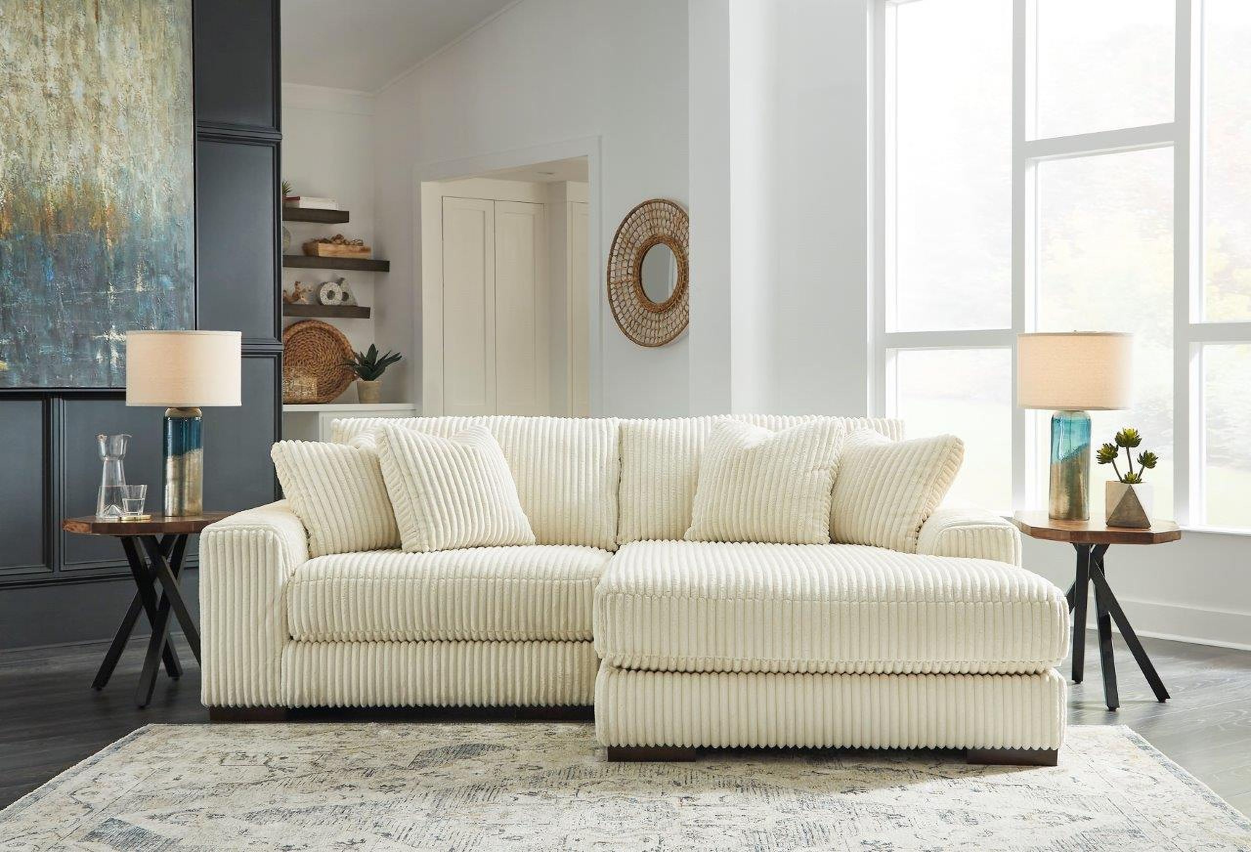 The appearance of Lindyn 2-Piece RAF Chaise Sectional In Ivory designed by Signature Design by Ashley in the modern / contemporary interior design. This ivory piece of furniture was selected by 1StopBedrooms from Lindyn Collection to add a touch of cosiness and style into your home. Sku: 2110464;2110417. Material: Polyester. Layout: Sofa & Chaise. Orientation: RAF.