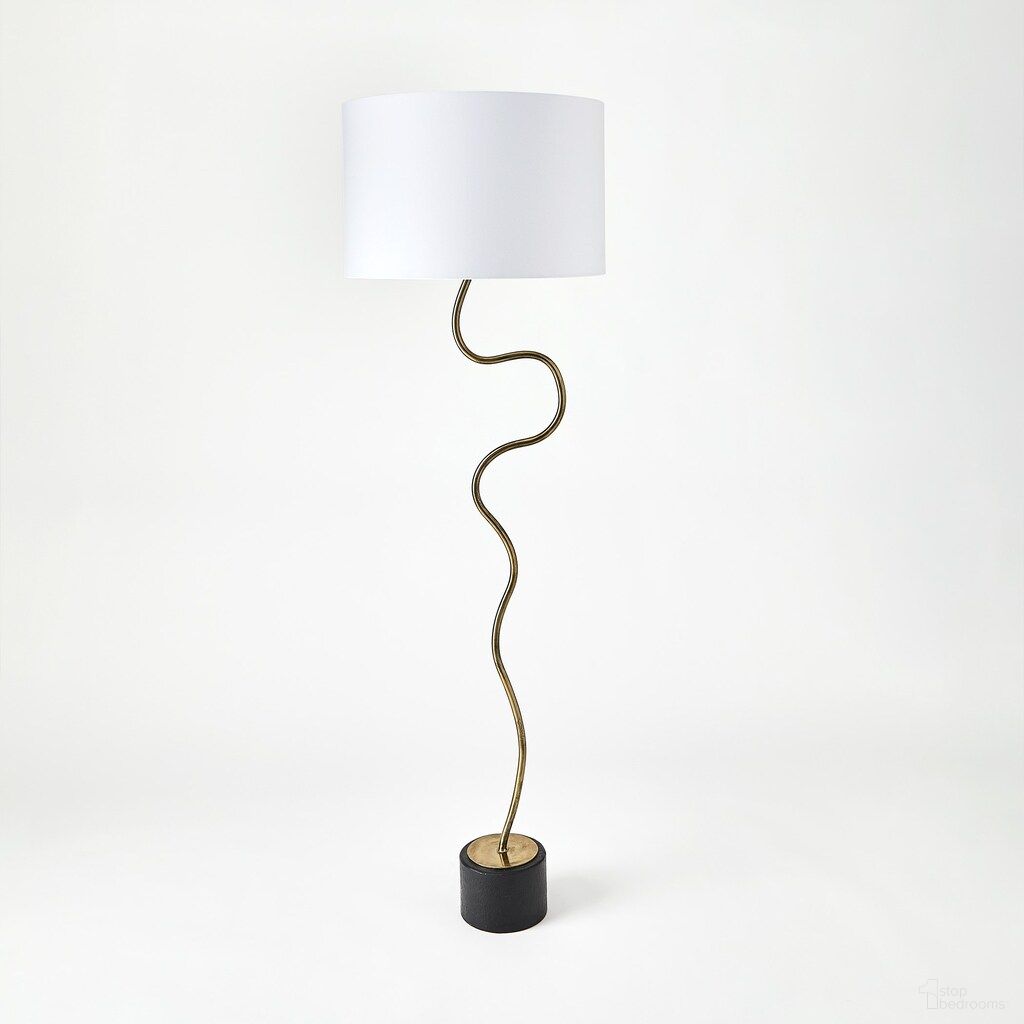 The appearance of Loop Floor Lamp In Brass designed by Global Views in the modern / contemporary interior design. This brass piece of furniture  was selected by 1StopBedrooms from Loop Collection to add a touch of cosiness and style into your home. Sku: 780709. Material: Ceramic.
