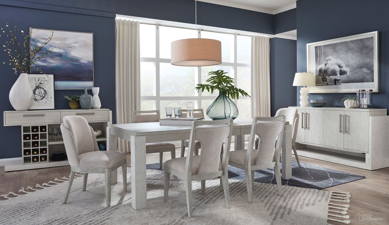 The appearance of Lorelei Extendable Rectangular Dining Set In Misty Cloud designed by Magnussen in the transitional interior design. This misty cloud piece of furniture was selected by 1StopBedrooms from Lorelei Collection to add a touch of cosiness and style into your home. Sku: D5893-20;D5893-63. Material: MDF. Table Top Shape: Rectangular. Size: 68" x 44".