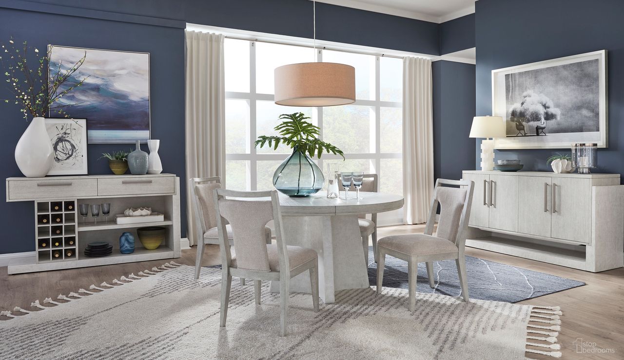 The appearance of Lorelei Extendable Round Dining Set In Misty Cloud designed by Magnussen in the transitional interior design. This misty cloud piece of furniture was selected by 1StopBedrooms from Lorelei Collection to add a touch of cosiness and style into your home. Sku: D5893-24T;D5893-24B;D5893-63. Table Top Shape: Round. Material: MDF. Size: 54".
