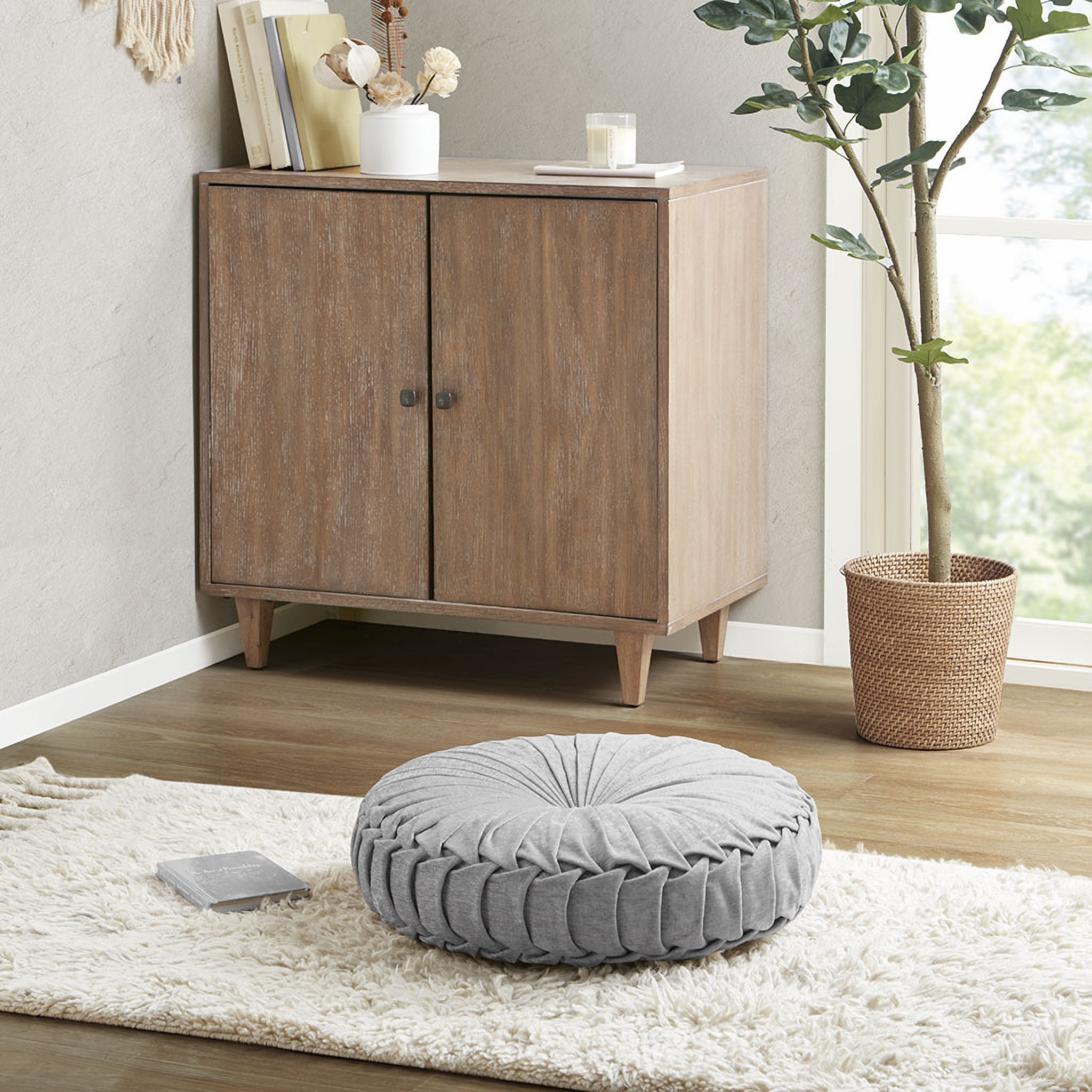 The appearance of Loretta Polyester Chenille Round Floor Pillow Cushion In Grey designed by Olliix in the transitional interior design. This grey piece of furniture was selected by 1StopBedrooms from Loretta Collection to add a touch of cosiness and style into your home. Sku: ID31-2033. Material: Polyester.