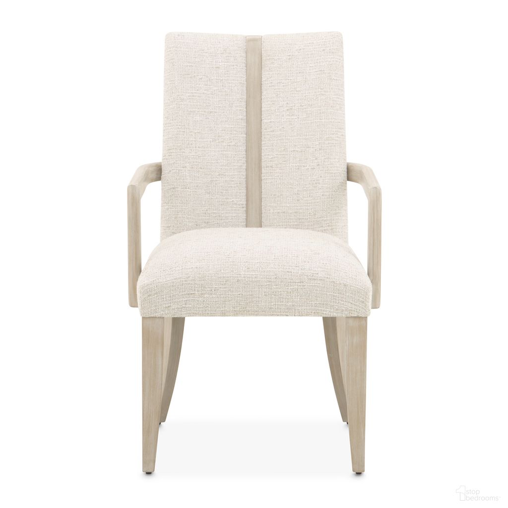 The appearance of Lotus Bay Dining Arm Chair In Sand designed by Michael Amini in the transitional interior design. This sand piece of furniture  was selected by 1StopBedrooms from Lotus Bay Collection to add a touch of cosiness and style into your home. Sku: 9030004A-138. Chair Type: Arm Chair. Material: Solid Wood.
