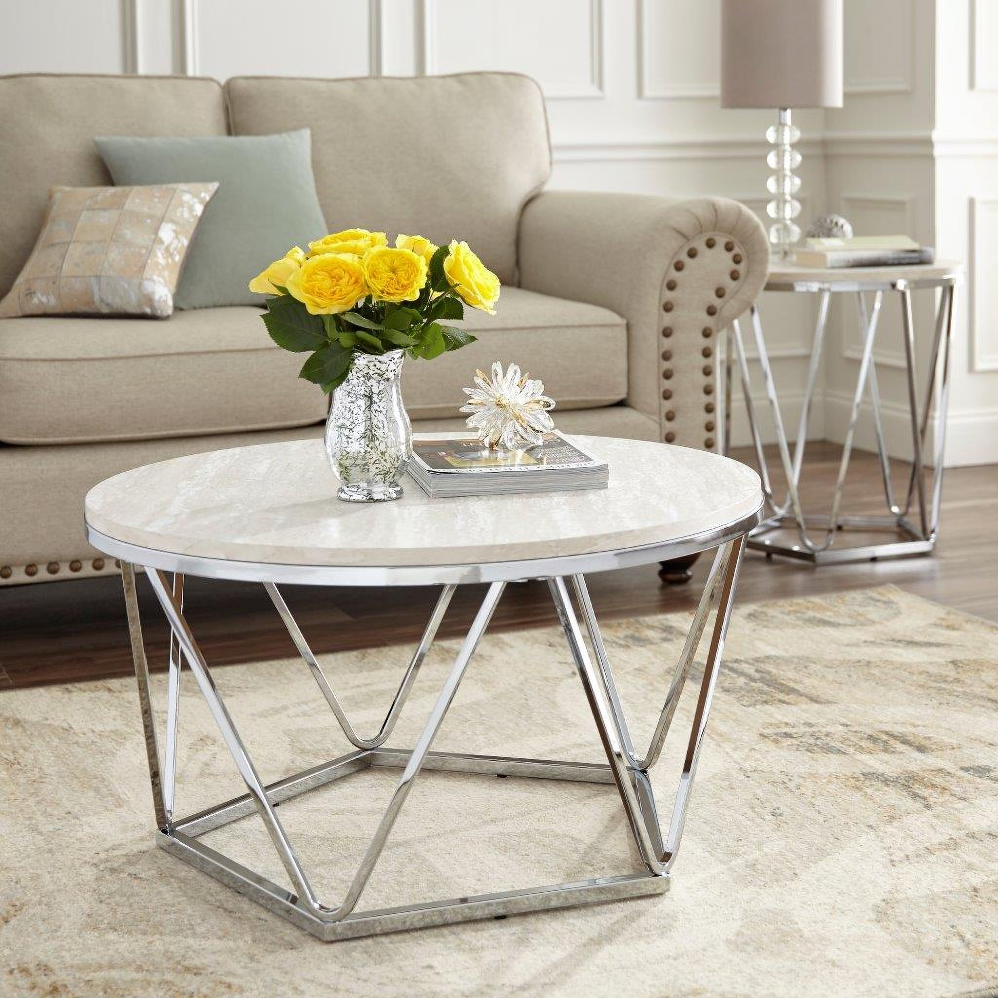 The appearance of Luna Faux Stone Round Coffee Table In Silver designed by SEI Furniture in the glam interior design. This silver piece of furniture  was selected by 1StopBedrooms from Luna Collection to add a touch of cosiness and style into your home. Sku: CK5980. Material: Wood.