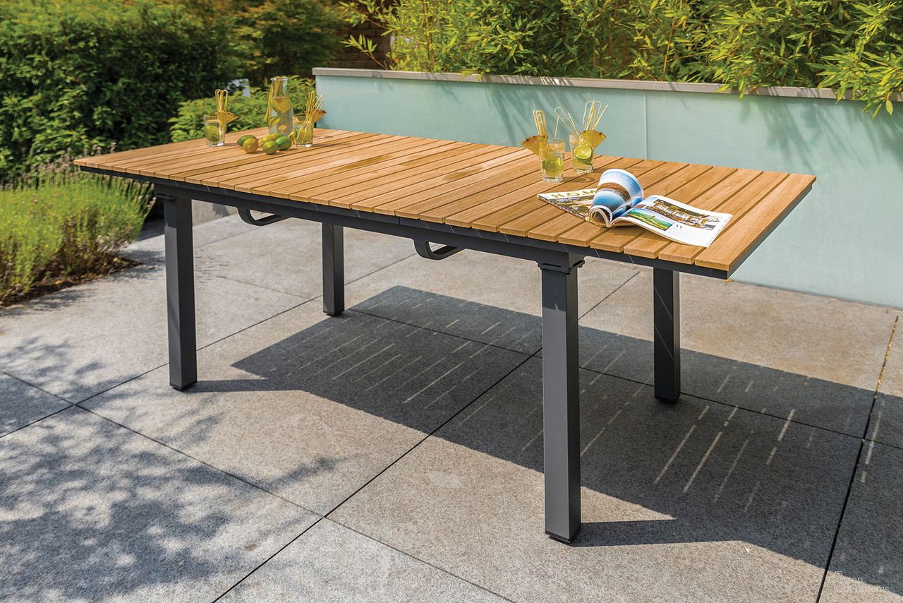 The appearance of Mackay Patio Dining Table In Gun Metal and Natural Teak designed by Furniture of America in the modern / contemporary interior design. This gun metal and natural teak piece of furniture was selected by 1StopBedrooms from Mackay Collection to add a touch of cosiness and style into your home. Sku: GM-2001. Table Base Style: Legs. Material: Aluminum. Table Top Shape: Rectangular.