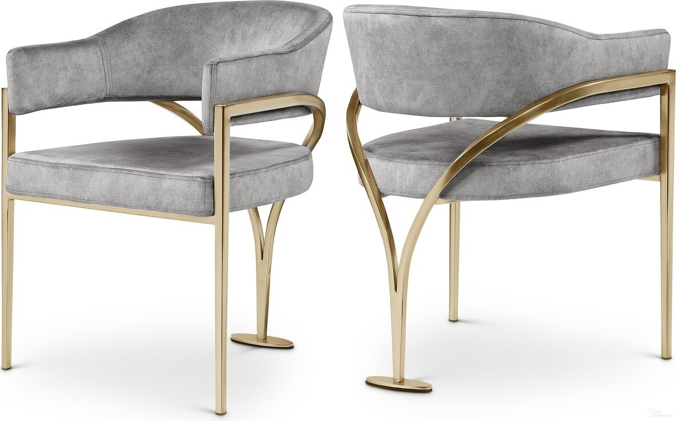 The appearance of Madelyn Velvet Dining Chair Set of 2 In Grey/Gold designed by Meridian in the modern / contemporary interior design. This grey piece of furniture  was selected by 1StopBedrooms from Madelyn Collection to add a touch of cosiness and style into your home. Sku: 553Grey-C. Material: Velvet. Chair Type: Arm Chair.