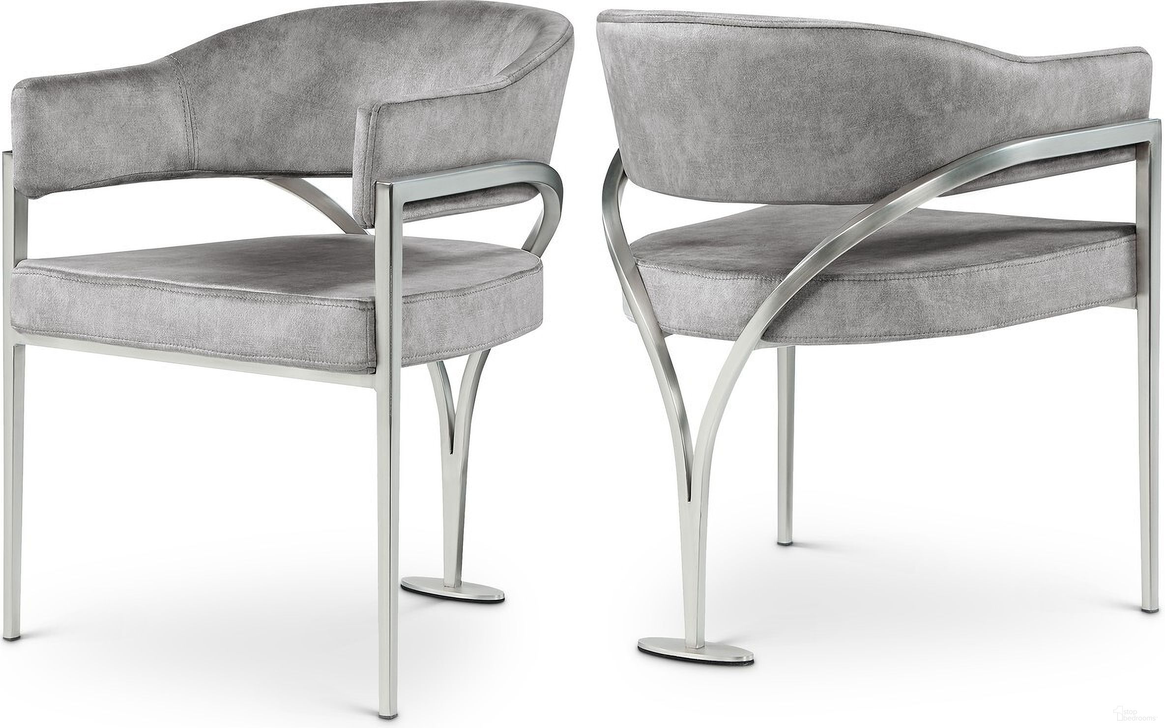 The appearance of Madelyn Velvet Dining Chair Set of 2 In Grey/Silver designed by Meridian in the modern / contemporary interior design. This grey piece of furniture was selected by 1StopBedrooms from Madelyn Collection to add a touch of cosiness and style into your home. Sku: 554Grey-C. Material: Velvet. Chair Type: Arm Chair.