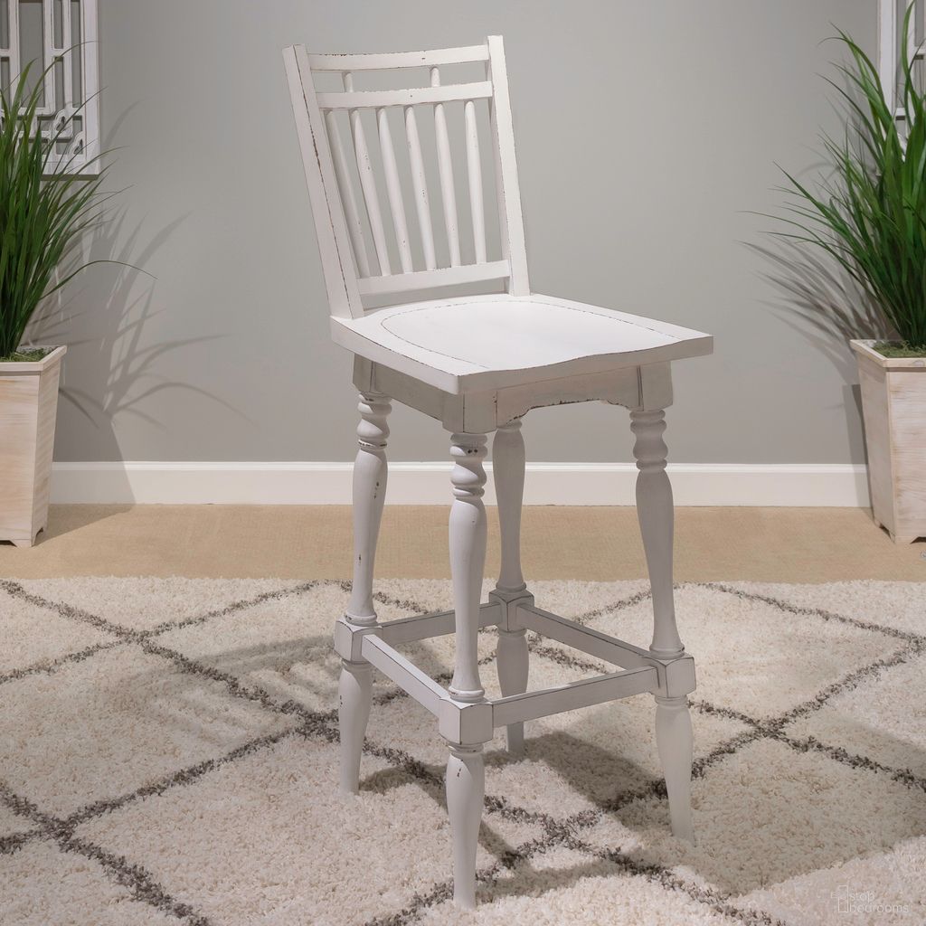 The appearance of Magnolia Manor Spindle Back Swivel Barstool Set of 2 In White designed by Liberty in the traditional interior design. This white piece of furniture was selected by 1StopBedrooms from Magnolia Manor Collection to add a touch of cosiness and style into your home. Sku: 244-B400330. Material: Rubberwood.