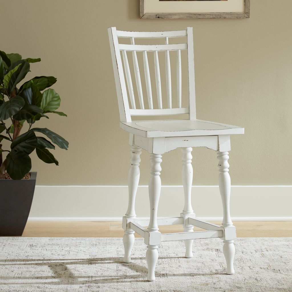 The appearance of Magnolia Manor Spindle Back Swivel Counter Height Chair Set of 2 In White designed by Liberty in the traditional interior design. This white piece of furniture was selected by 1StopBedrooms from Magnolia Manor Collection to add a touch of cosiness and style into your home. Sku: 244-B400324. Material: Rubberwood.