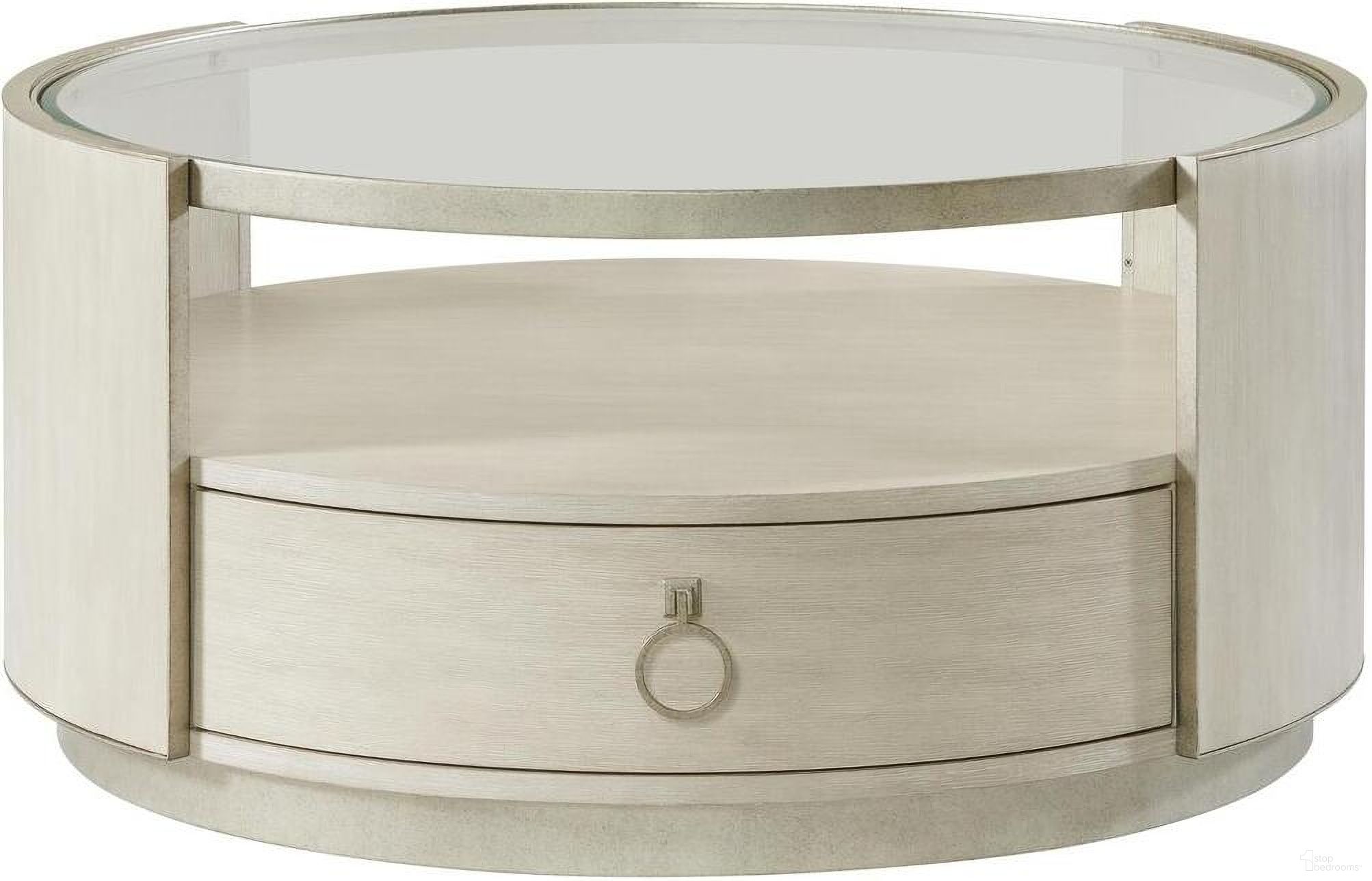 The appearance of Maisie Round Coffee Table In Champagne designed by Riverside Furniture in the glam interior design. This champagne piece of furniture was selected by 1StopBedrooms from Maisie Collection to add a touch of cosiness and style into your home. Sku: 50203. Material: Wood.