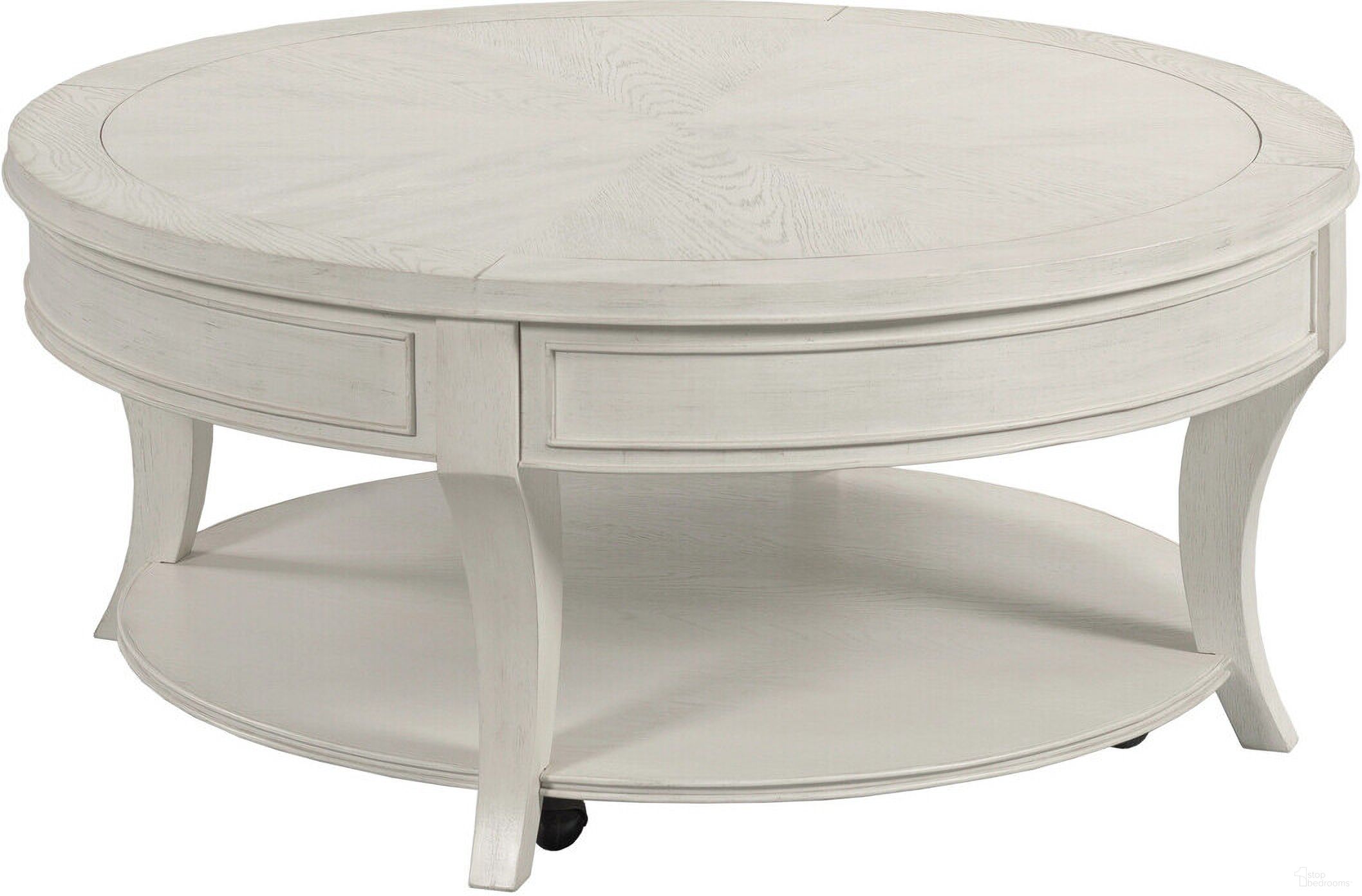 The appearance of Marcella Round Coffee Table In Eggshell designed by American Drew in the transitional interior design. This eggshell piece of furniture was selected by 1StopBedrooms from Harmony Collection to add a touch of cosiness and style into your home. Sku: 266-911. Material: Wood.
