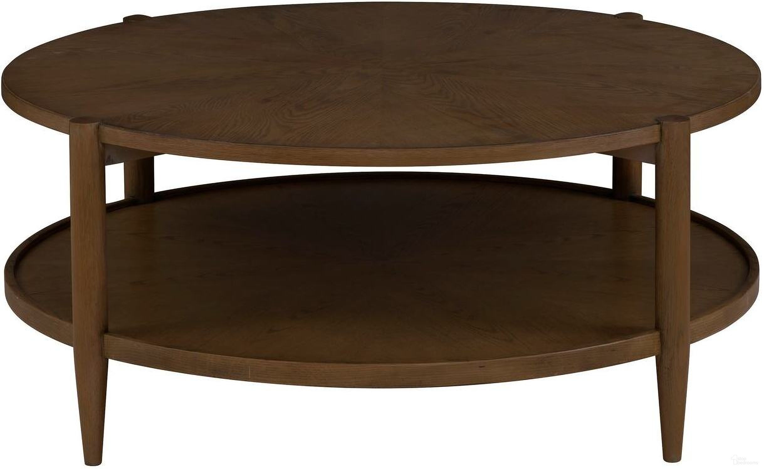The appearance of Maxwell Round Cocktail Table In Caramel designed by Fairfield Chair in the transitional interior design. This caramel piece of furniture  was selected by 1StopBedrooms from Maxwell Collection to add a touch of cosiness and style into your home. Sku: 8057-13-C. Material: Solid Oak.