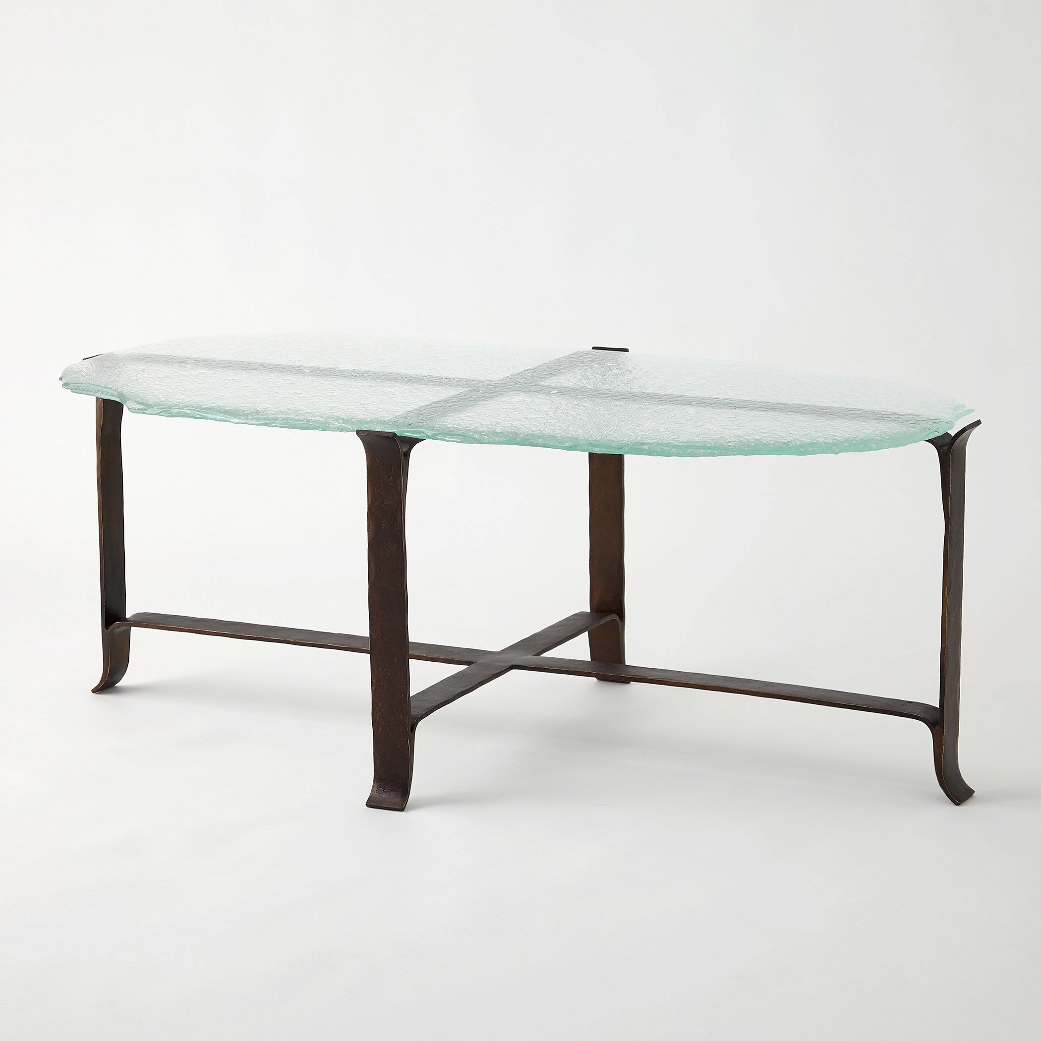 The appearance of Melting Glass Cocktail Table In Bronze designed by Global Views in the modern / contemporary interior design. This bronze piece of furniture was selected by 1StopBedrooms from Melting Collection to add a touch of cosiness and style into your home. Sku: 993853. Material: Iron.