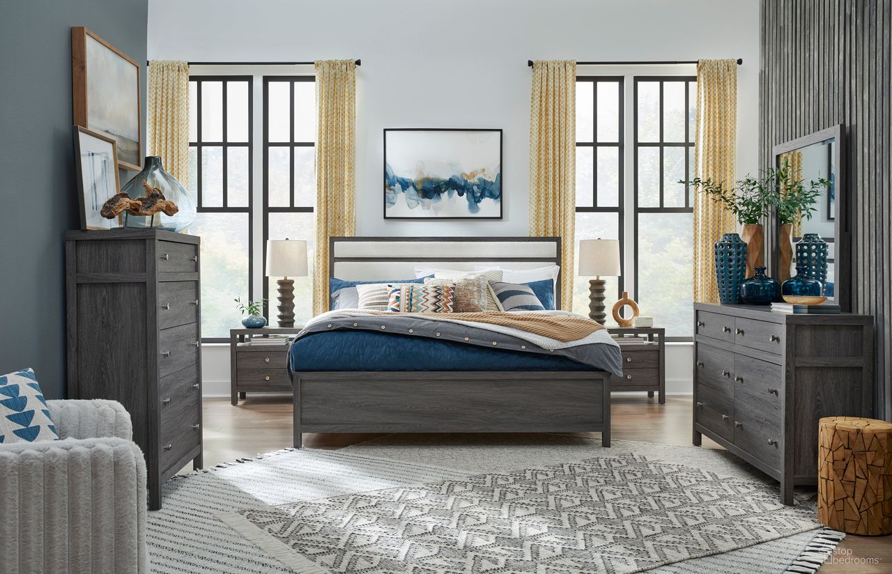 The appearance of Merrifield Upholstered Panel Bedroom Set In Raisin Black designed by Magnussen in the transitional interior design. This raisin black piece of furniture was selected by 1StopBedrooms from Merrifield Collection to add a touch of cosiness and style into your home. Sku: B6308-55H;B6308-54F;B6308-54R;B6308-01. Bed Size: King. Material: Hardwood.