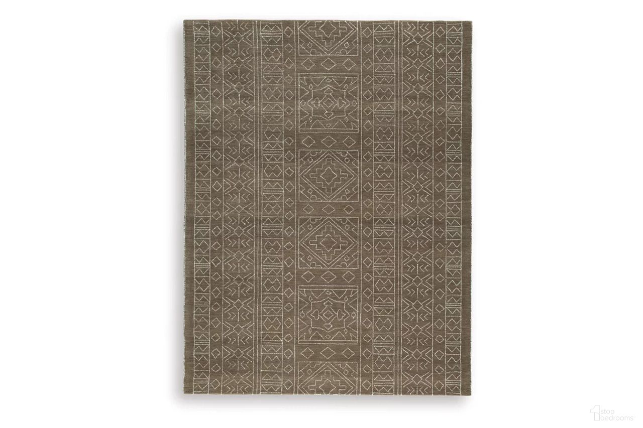 The appearance of Merrittman 7'8" x 10' Area Rug In Brown and Ivory designed by Signature Design by Ashley in the transitional interior design. This brown/ivory piece of furniture was selected by 1StopBedrooms from Merrittman Collection to add a touch of cosiness and style into your home. Sku: R407701.