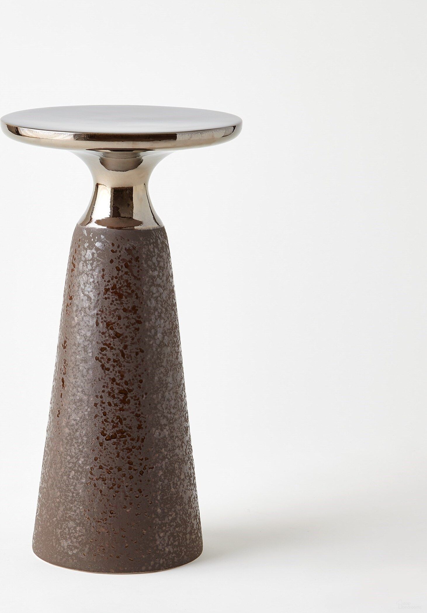 The appearance of Meteor Taper Table In Bronze designed by Global Views in the modern / contemporary interior design. This bronze piece of furniture  was selected by 1StopBedrooms from Meteor Collection to add a touch of cosiness and style into your home. Sku: 110747. Material: Porcelain.
