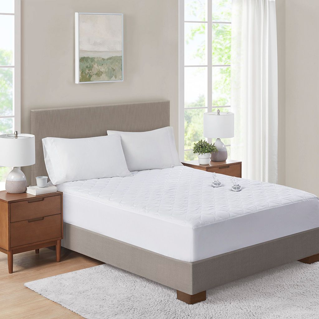 The appearance of Microfiber Heated King Mattress Pad In White designed by Olliix in the transitional interior design. This white piece of furniture  was selected by 1StopBedrooms from Microfiber Collection to add a touch of cosiness and style into your home. Sku: ST55-0270. Material: Microfiber. Bed Size: King. Mattress Size: King.