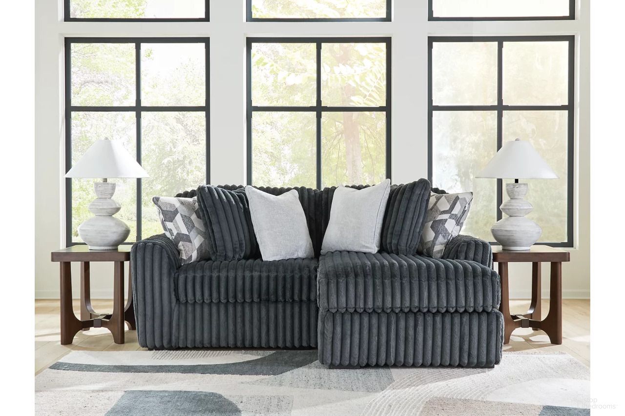The appearance of Midnight-Madness 2-Piece Sectional with RAF Chaise In Gunmetal designed by Signature Design by Ashley in the modern / contemporary interior design. This gunmetal piece of furniture was selected by 1StopBedrooms from Midnight-Madness Collection to add a touch of cosiness and style into your home. Sku: 9810564;9810517. Material: Polyester. Layout: RAF.