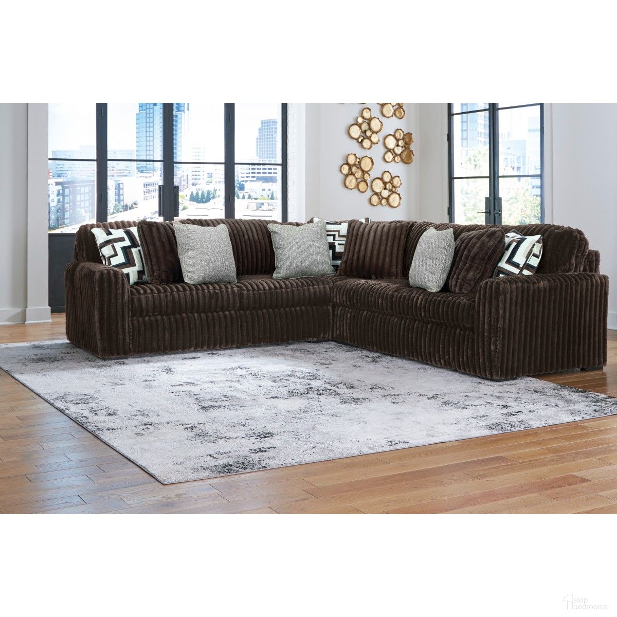 The appearance of Midnight-Madness 3-Piece Sectional In Chocolate designed by Signature Design by Ashley in the modern / contemporary interior design. This chocolate piece of furniture  was selected by 1StopBedrooms from Midnight-Madness Collection to add a touch of cosiness and style into your home. Sku: 9810466;9810477;9810467. Material: Polyester. Layout: L-Shape.