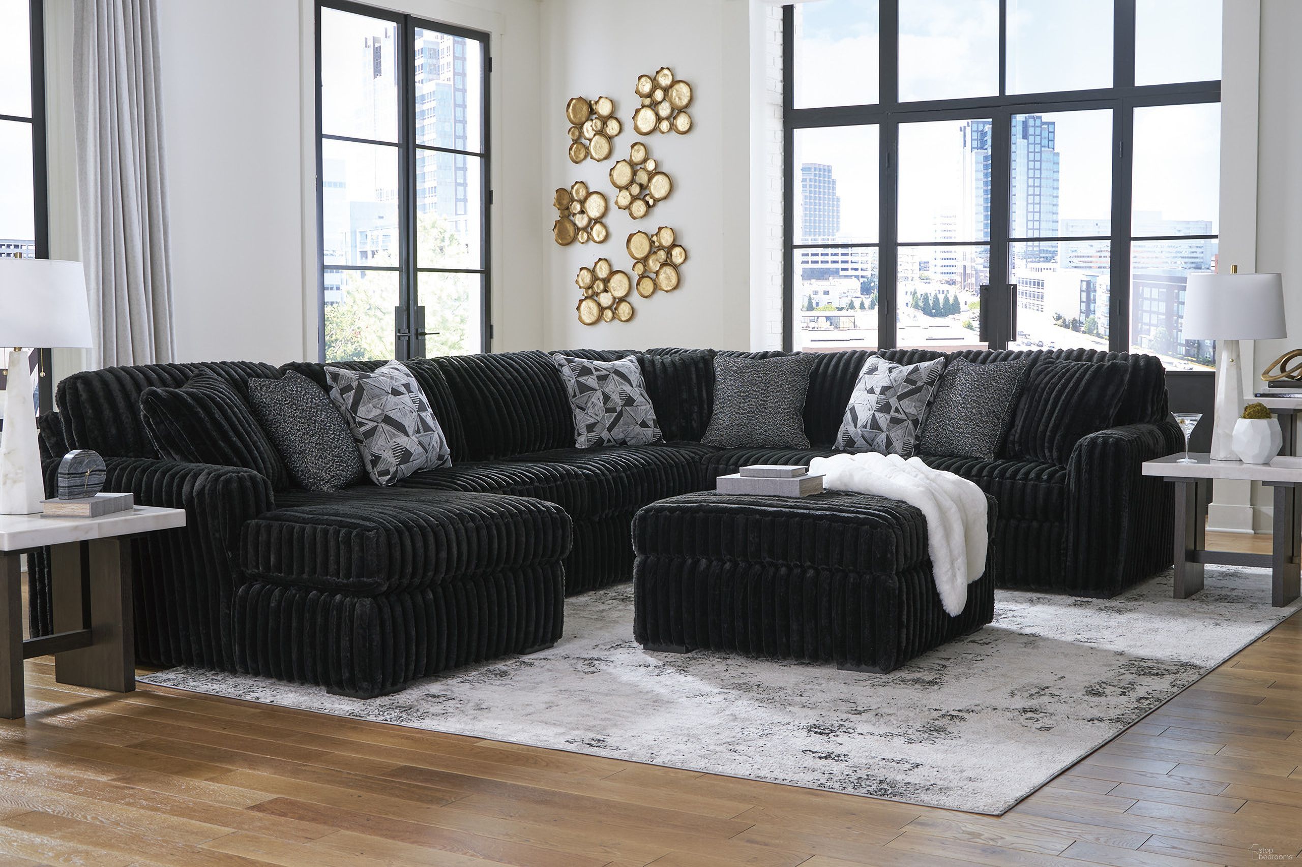 The appearance of Midnight-Madness 4-Piece Sectional and Ottoman In Onyx designed by Signature Design by Ashley in the modern / contemporary interior design. This onyx piece of furniture was selected by 1StopBedrooms from Midnight-Madness Collection to add a touch of cosiness and style into your home. Sku: 9810316;9810308;9810334;9810377;9810367. Material: Corduroy.