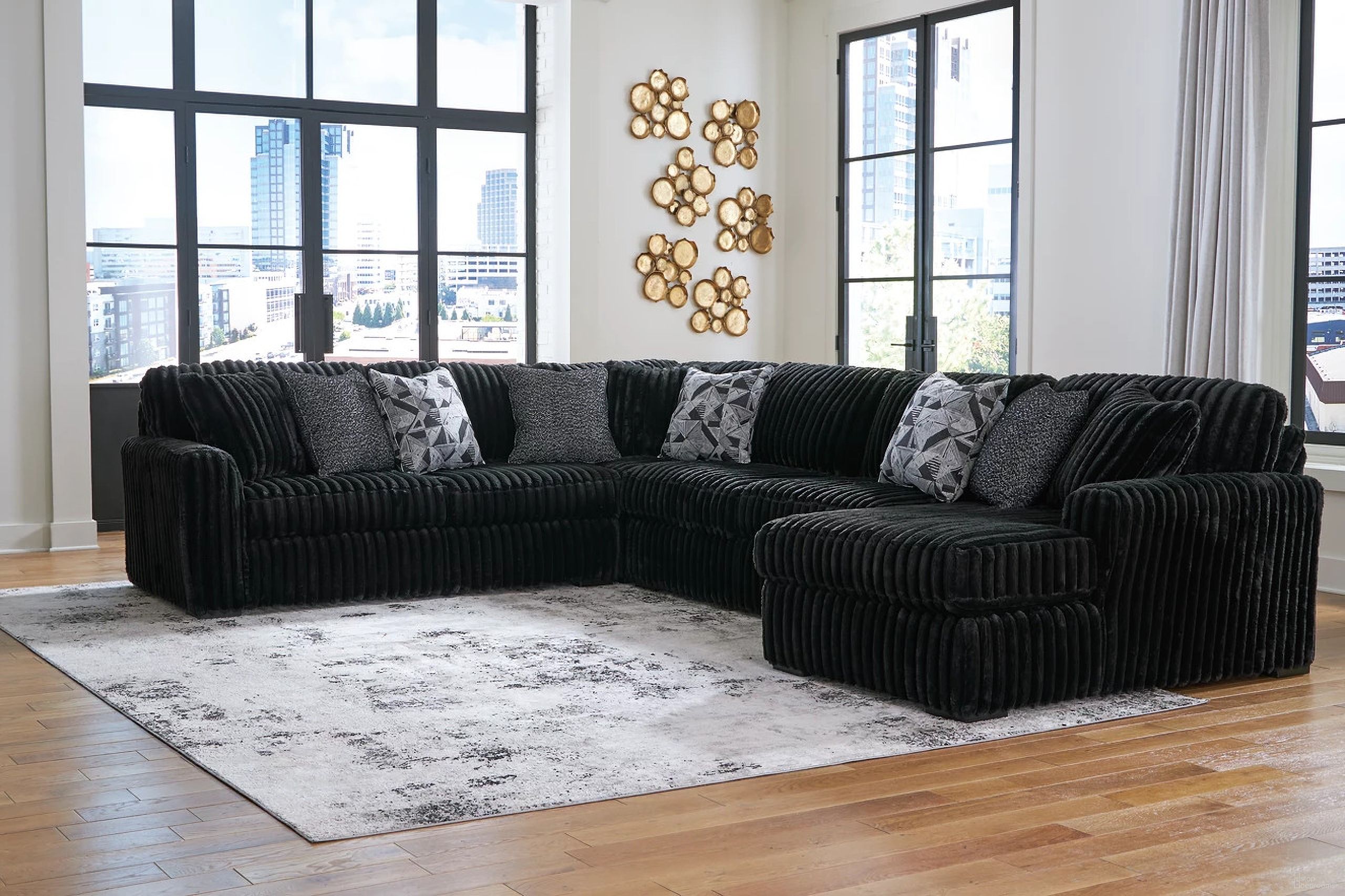The appearance of Midnight-Madness 4-Piece Sectional With RAF Chaise In Onyx designed by Signature Design by Ashley in the modern / contemporary interior design. This onyx piece of furniture was selected by 1StopBedrooms from Midnight-Madness Collection to add a touch of cosiness and style into your home. Sku: 9810366;9810377;9810334;9810317. Layout: U-Shape. Orientation: RAF. Material: Corduroy.