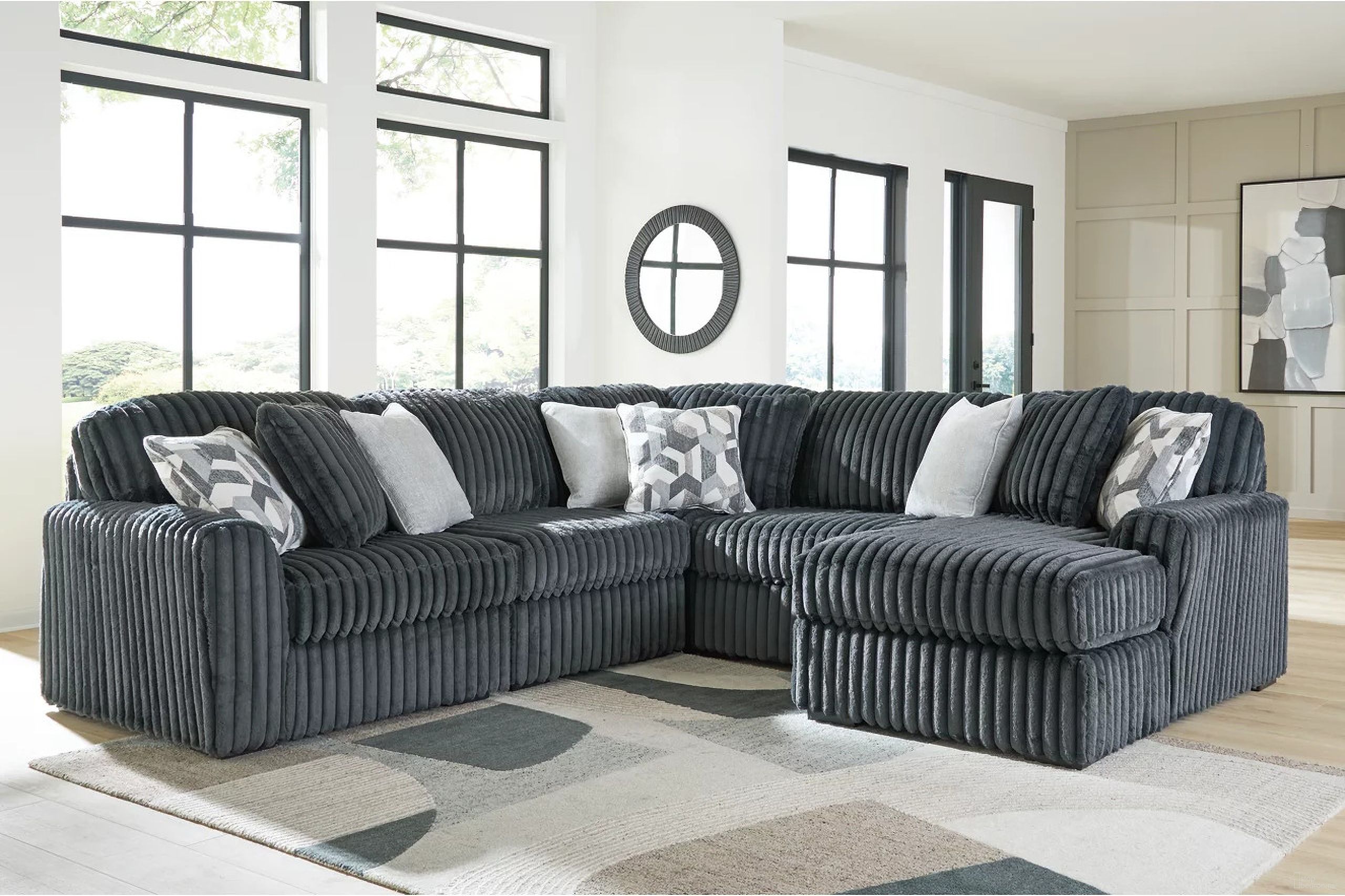 The appearance of Midnight-Madness 5-Piece Sectional with RAF Chaise In Gunmetal designed by Signature Design by Ashley in the modern / contemporary interior design. This gunmetal piece of furniture was selected by 1StopBedrooms from Midnight-Madness Collection to add a touch of cosiness and style into your home. Sku: 9810564;9810546;9810546;9810577;9810517. Material: Polyester.