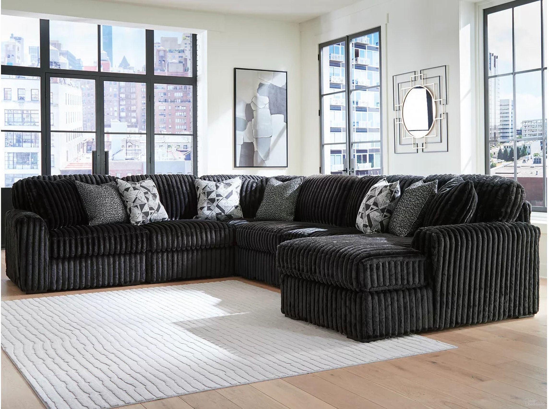 The appearance of Midnight-Madness 6-Piece RAF Sectional with Chaise In Onyx designed by Signature Design by Ashley in the modern / contemporary interior design. This onyx piece of furniture was selected by 1StopBedrooms from Midnight-Madness Collection to add a touch of cosiness and style into your home. Sku: 9810317;9810346;9810346;9810346;9810364;9810377. Material: Polyester. Orientation: RAF.