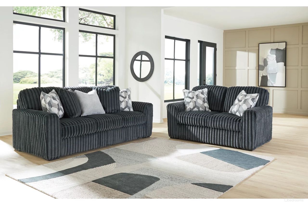The appearance of Midnight-Madness Living Room Set In Gunmetal designed by Signature Design by Ashley in the modern / contemporary interior design. This gunmetal piece of furniture  was selected by 1StopBedrooms from Midnight-Madness Collection to add a touch of cosiness and style into your home. Sku: 9810538;9810535. Material: Fabric.