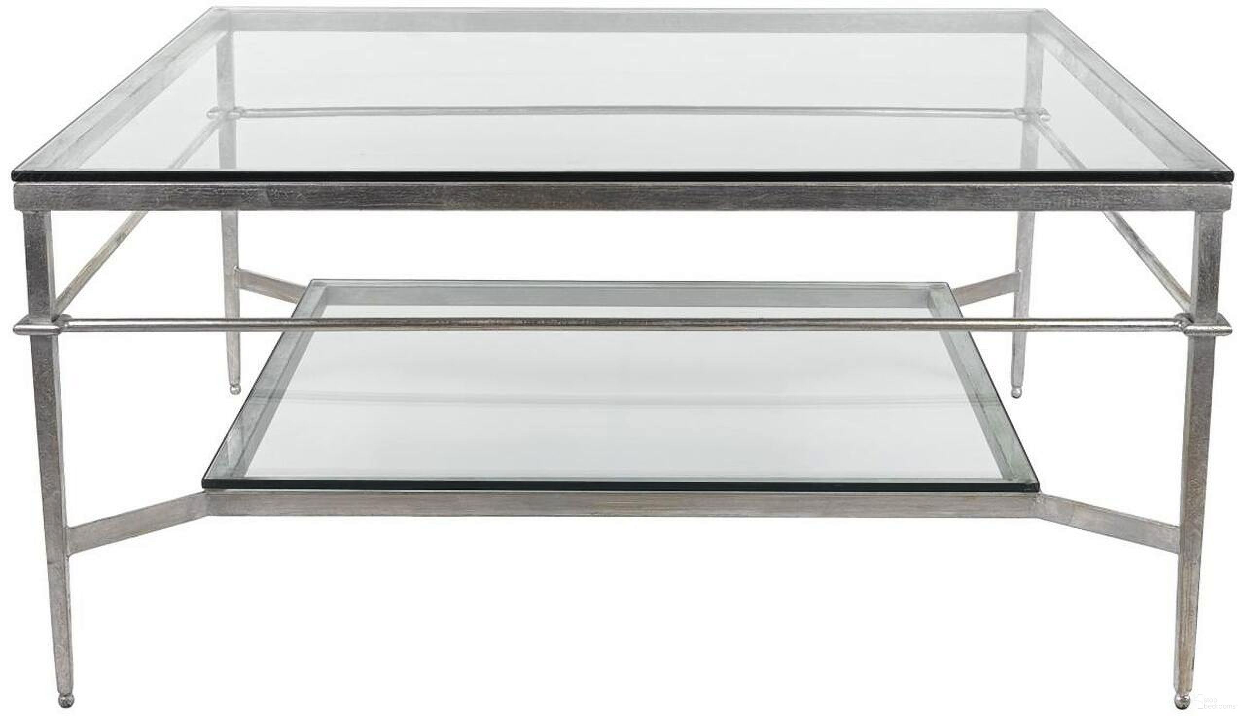The appearance of Mieka Cocktail Table In Silver And Glass designed by Safavieh Couture in the transitional interior design. This silver piece of furniture  was selected by 1StopBedrooms from Mieka Collection to add a touch of cosiness and style into your home. Sku: AMH8307B. Material: Metal.