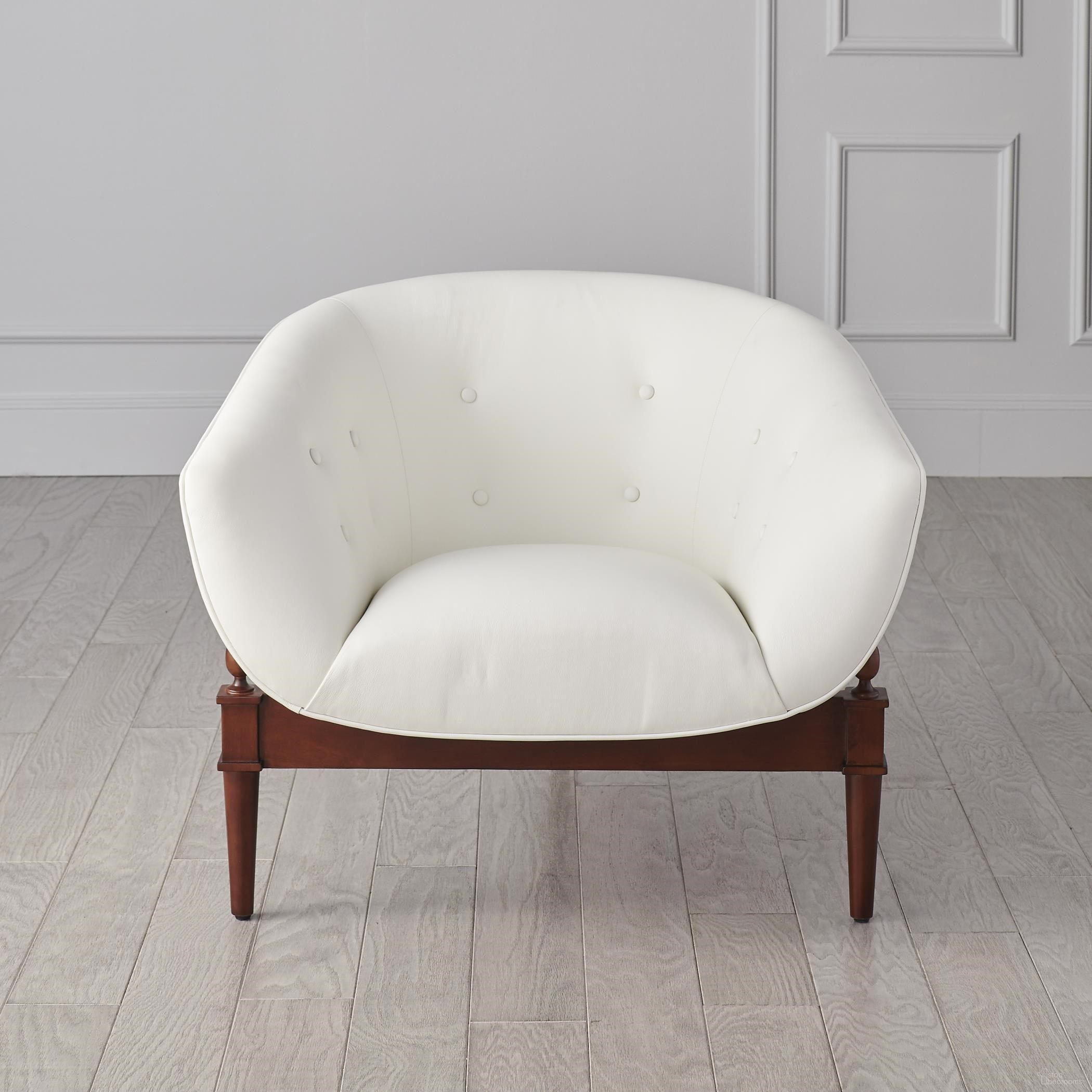 The appearance of Mimi Chair In White Leather designed by Global Views in the modern / contemporary interior design. This white piece of furniture was selected by 1StopBedrooms from Mimi Collection to add a touch of cosiness and style into your home. Sku: 2367. Material: Wood.