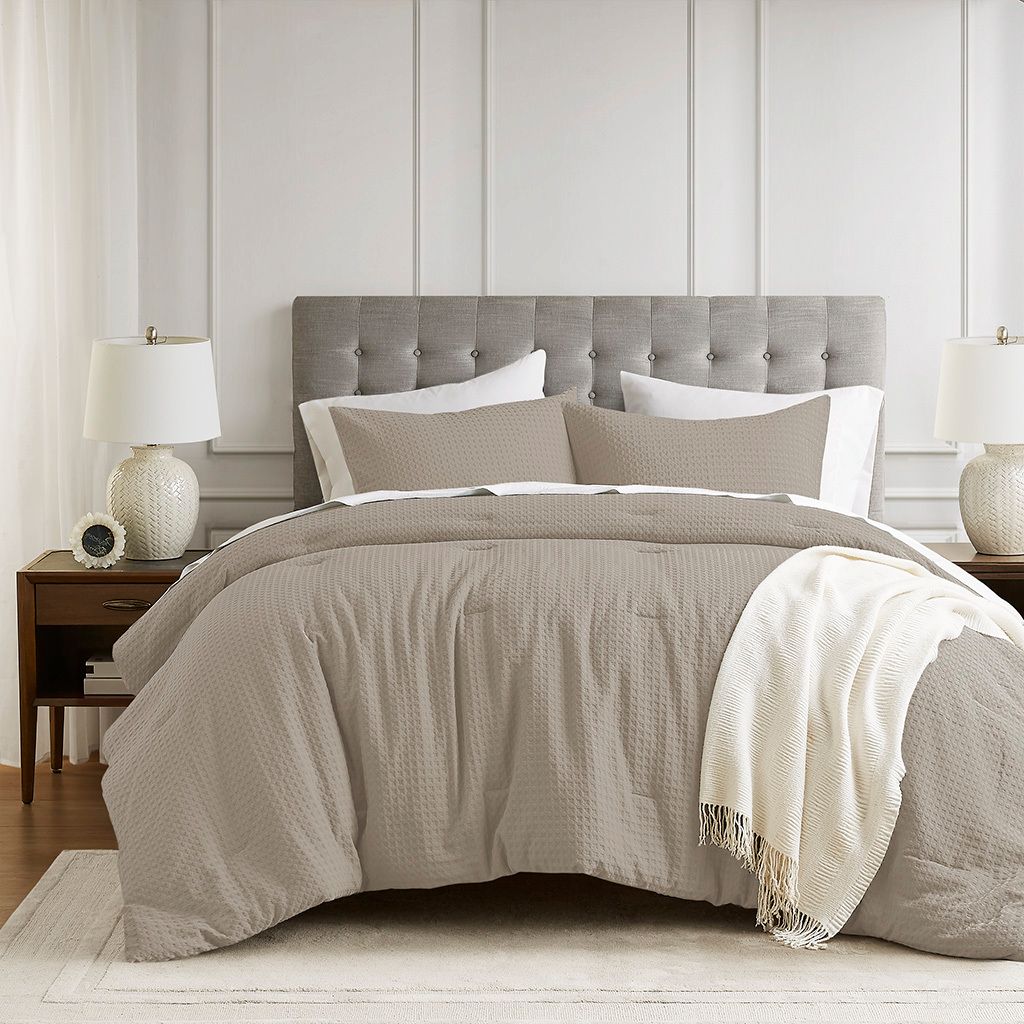 The appearance of Mina Waffle Weave Textured Comforter Set In Neutral designed by Olliix in the modern / contemporary interior design. This neutral piece of furniture was selected by 1StopBedrooms from Mina Collection to add a touch of cosiness and style into your home. Sku: AM10-0017. Material: Polyester. Bed Size: Full.
