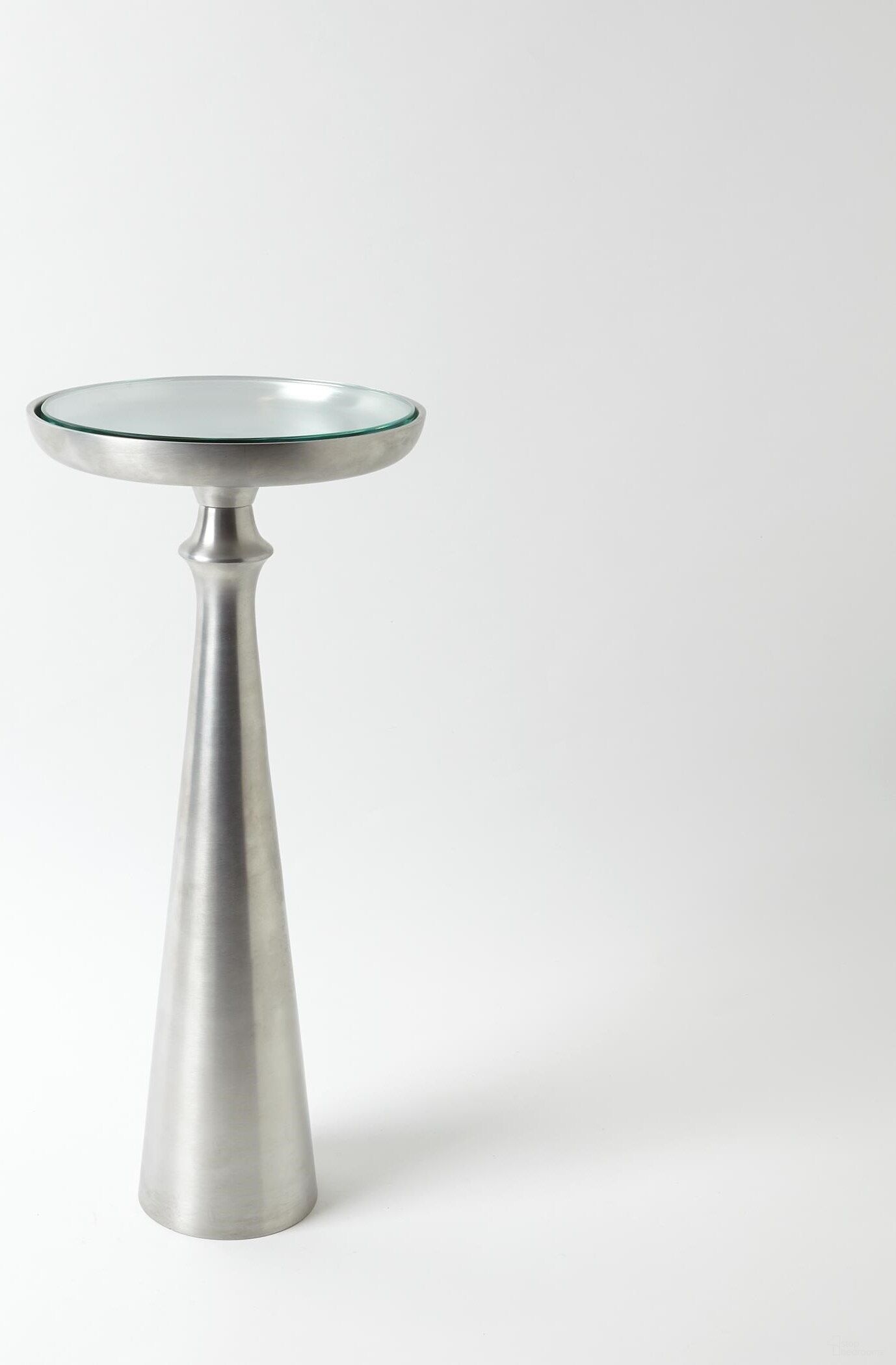 The appearance of Minaret Small Accent Table In Satin Nickel designed by Global Views in the modern / contemporary interior design. This gray piece of furniture  was selected by 1StopBedrooms from Minaret Collection to add a touch of cosiness and style into your home. Sku: 790769. Material: Aluminum.