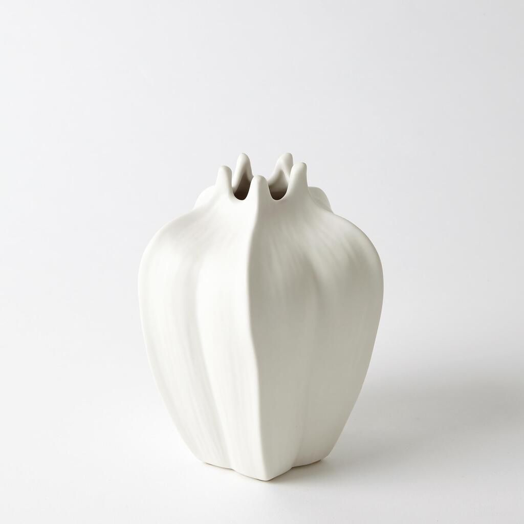 The appearance of Mini Tall Star Fruit Vase In White designed by Global Views in the modern / contemporary interior design. This white piece of furniture  was selected by 1StopBedrooms from Mini Collection to add a touch of cosiness and style into your home. Sku: 710084. Material: Porcelain.