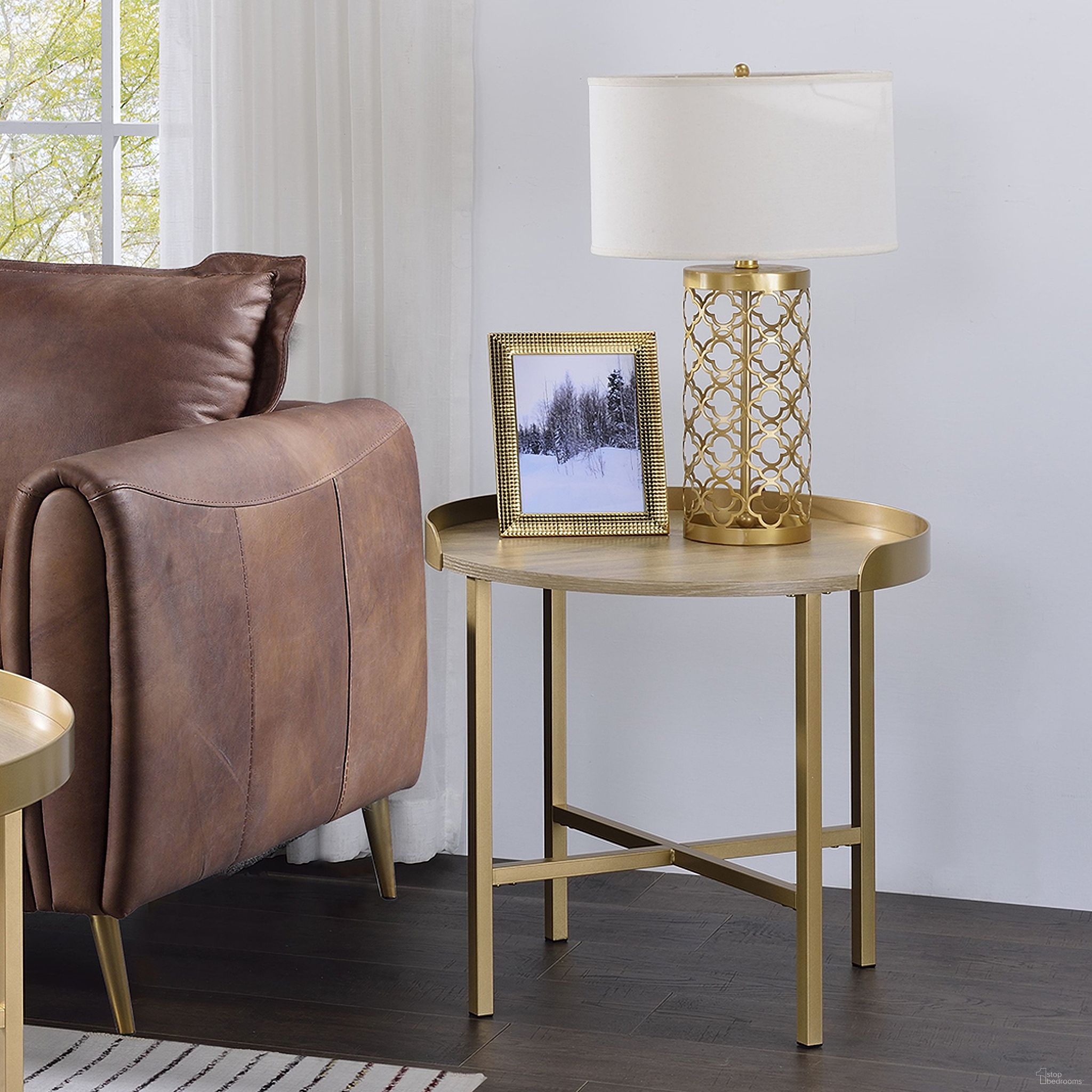 The appearance of Mithea End Table In Oak Table Top And Gold designed by ACME in the modern / contemporary interior design. This gold piece of furniture  was selected by 1StopBedrooms from Mithea Collection to add a touch of cosiness and style into your home. Sku: 82337. Material: Wood.