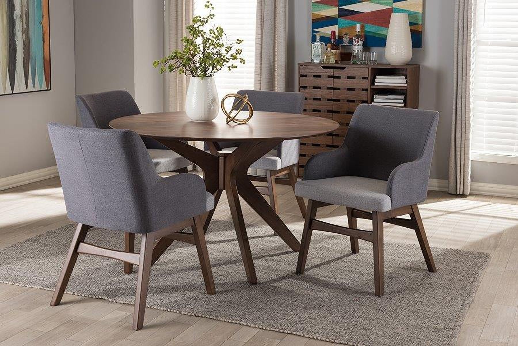 The appearance of Monte Mid-Century Modern Walnut Wood Round 5-Piece Dining Set designed by Baxton Studio in the transitional interior design. This walnut piece of furniture  was selected by 1StopBedrooms from Monte Collection to add a touch of cosiness and style into your home. Sku: Monte-Dark-Grey/Walnut 5PC Dining Set. Material: Rubberwood.