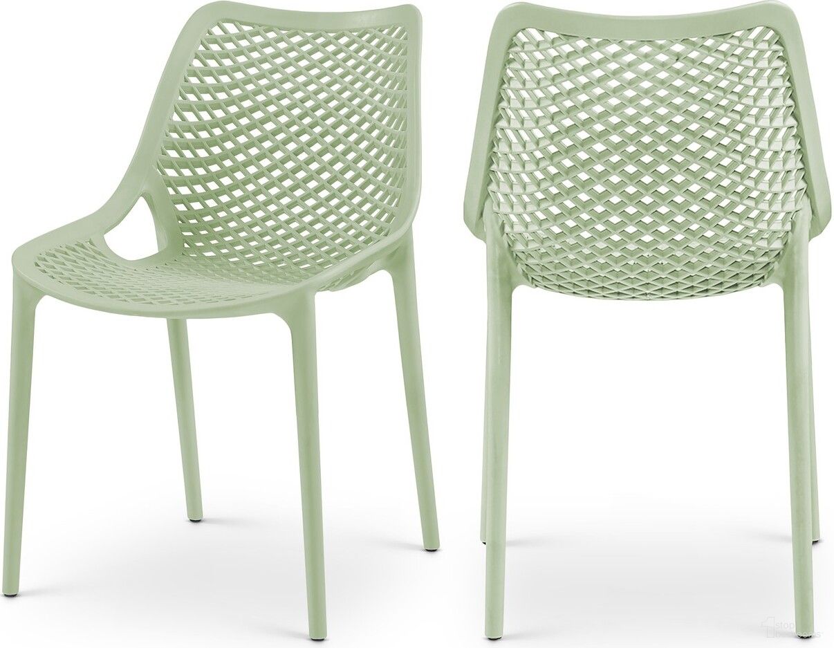 The appearance of Mykonos Outdoor Patio Dining Side Chair Set of 4 In Mint designed by Meridian in the modern / contemporary interior design. This mint piece of furniture was selected by 1StopBedrooms from Mykonos Collection to add a touch of cosiness and style into your home. Sku: 328Mint. Material: Polypropylene.
