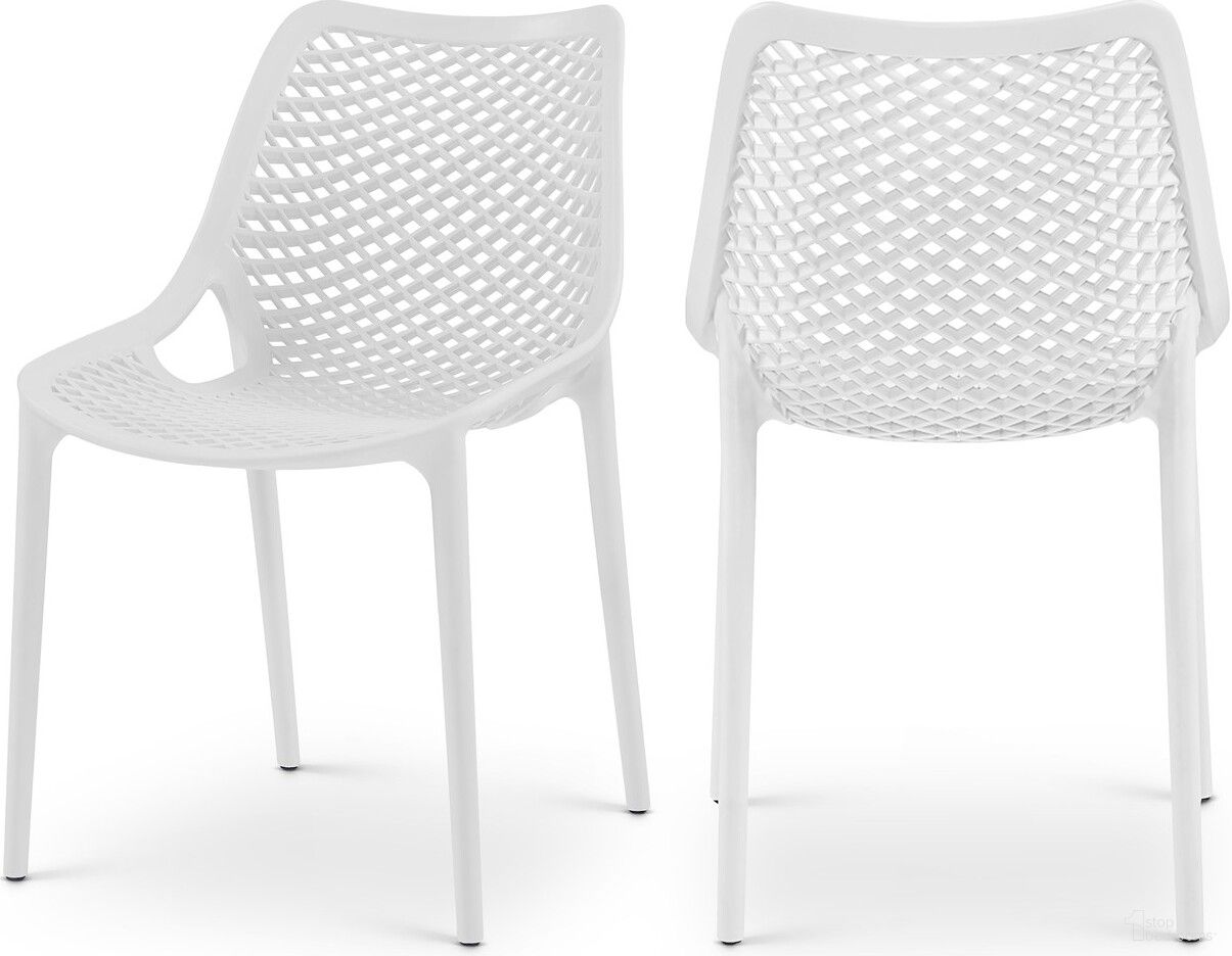 The appearance of Mykonos Outdoor Patio Dining Side Chair Set of 4 In White designed by Meridian in the modern / contemporary interior design. This white piece of furniture  was selected by 1StopBedrooms from Mykonos Collection to add a touch of cosiness and style into your home. Sku: 328White. Material: Polypropylene.