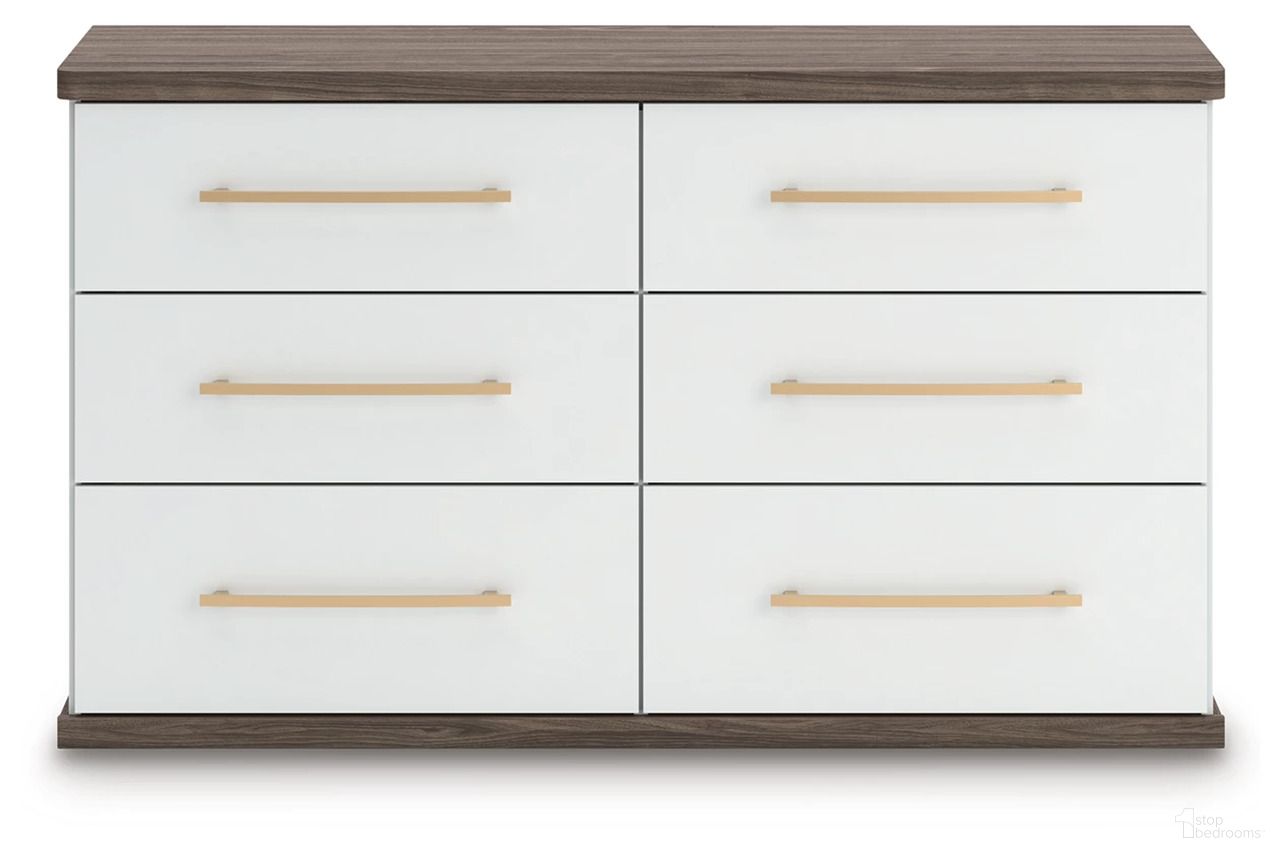 The appearance of Nendalane Dresser In White and Brown designed by Signature Design by Ashley in the modern / contemporary interior design. This white/brown piece of furniture  was selected by 1StopBedrooms from Nendalane Collection to add a touch of cosiness and style into your home. Sku: NCB1108-31. Material: Wood.